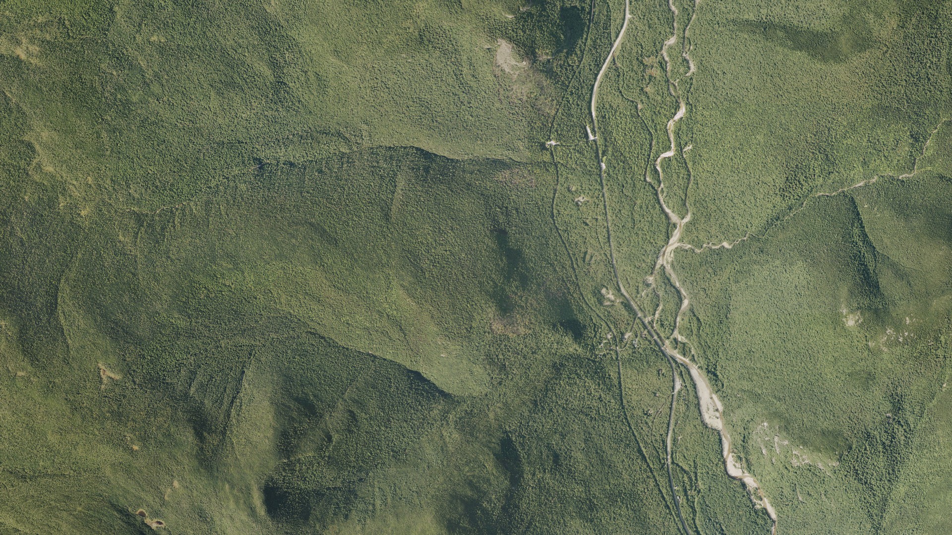 Natural-color aerial photograph of land around Hart's Location, New Hampshire