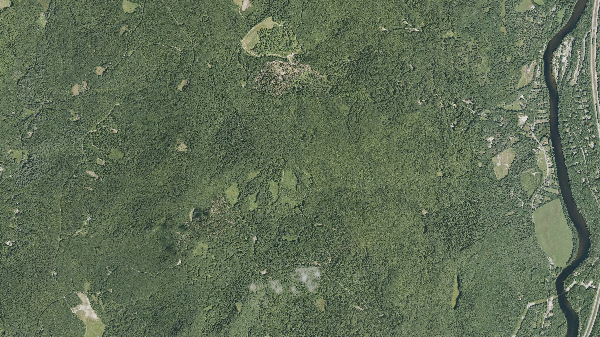 Natural-color aerial photograph of land around Bridgewater, New Hampshire