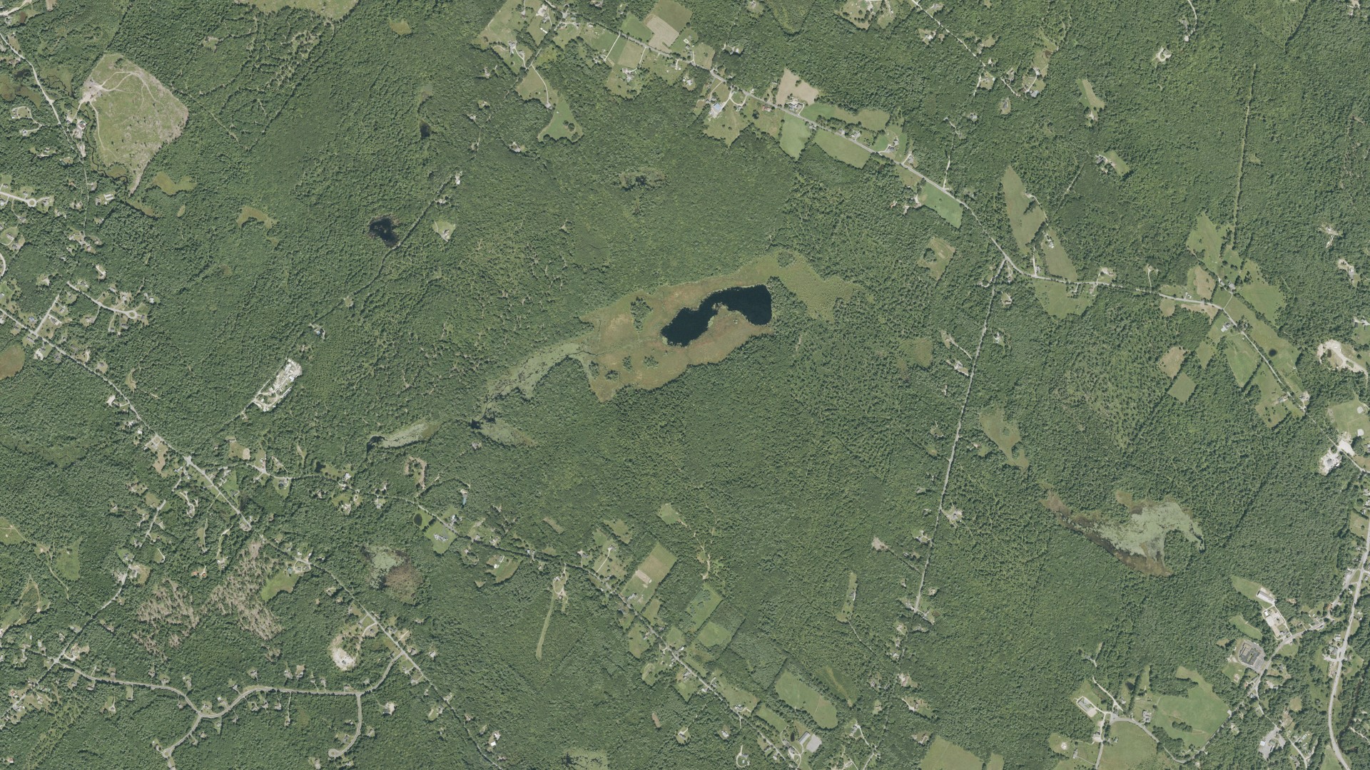 Natural-color aerial photograph of land around Chichester, New Hampshire