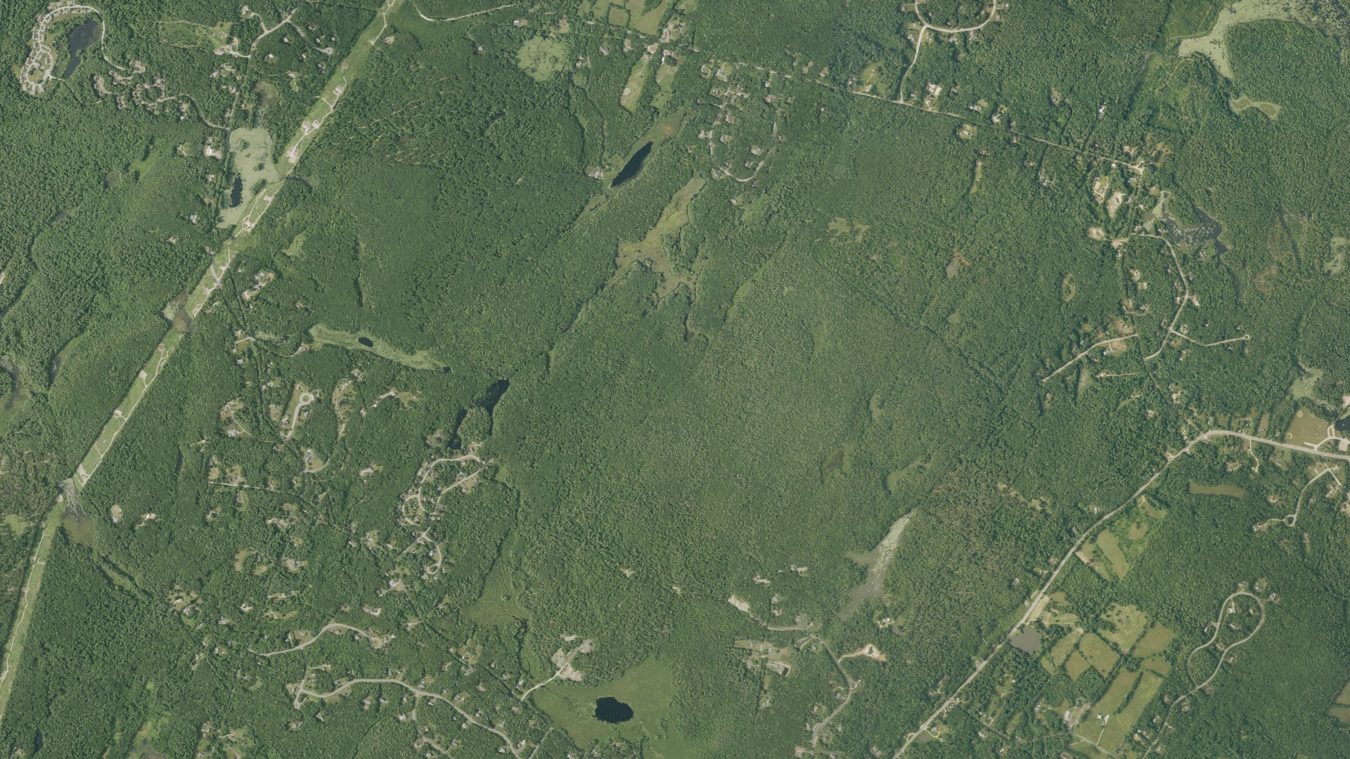 Natural-color aerial photograph of land around Chester, New Hampshire