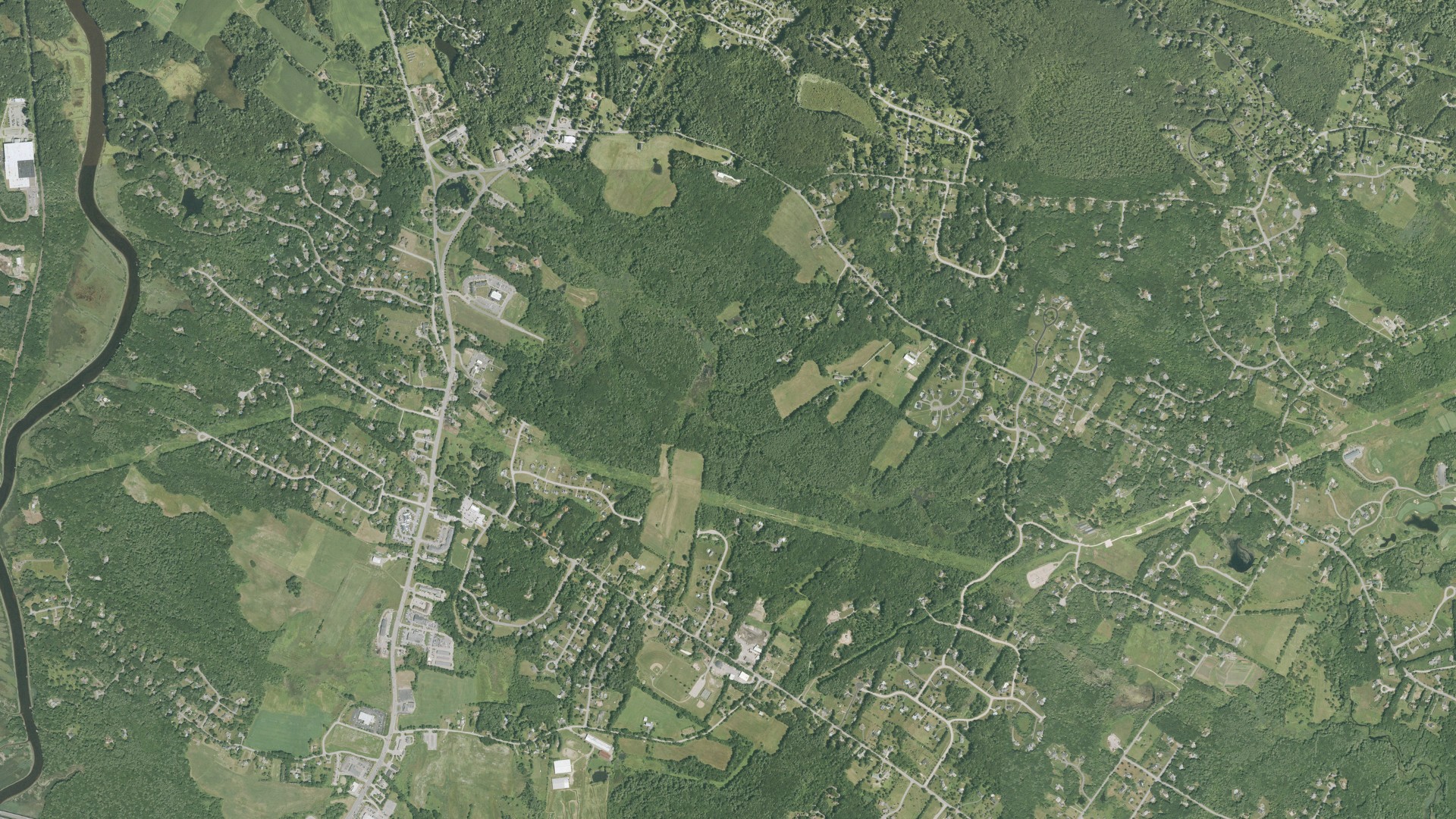 Natural-color aerial photograph of land around Stratham, New Hampshire
