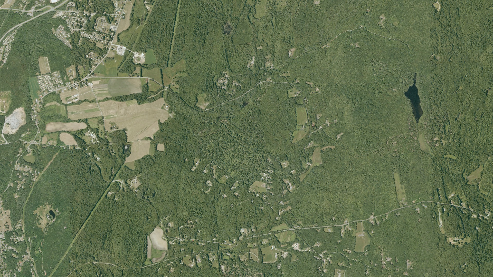 Natural-color aerial photograph of land around Charlestown, New Hampshire