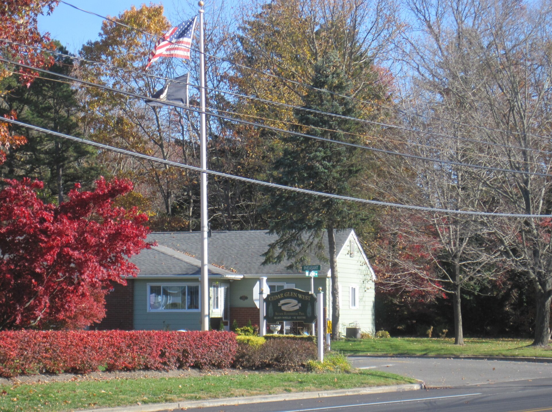 Photograph showing Cedar Glen West, New Jersey, a census-designated place within Manchester Township. Photo taken from Ridgeway Road (County Route 571) at its intersection with Pheasant Street.