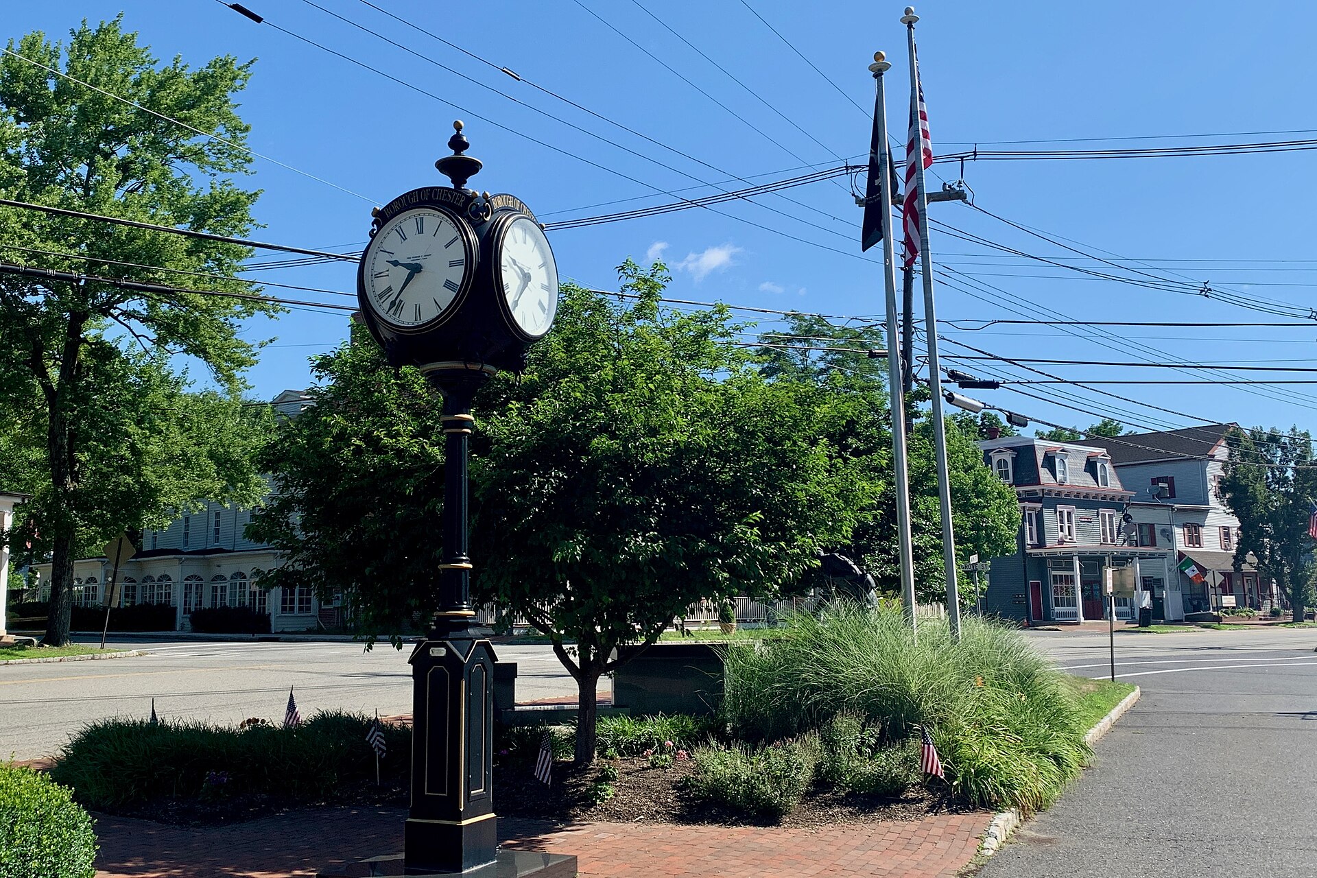 Street clock in downtown Chester Borough, New Jersey. The Chester House Inn is across Main Street behind the clock and tree.