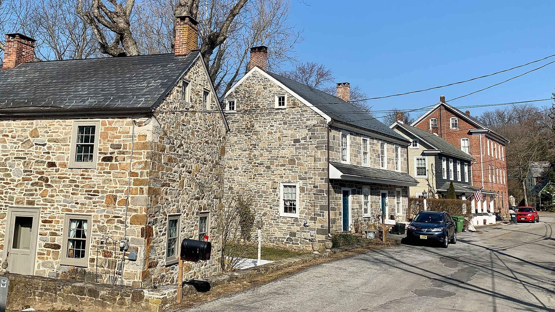 Stone and brick houses in Finesville, New Jersey. Contributing properties #11, #12, #13, and #14 of the Finesville–Seigletown Historic District.