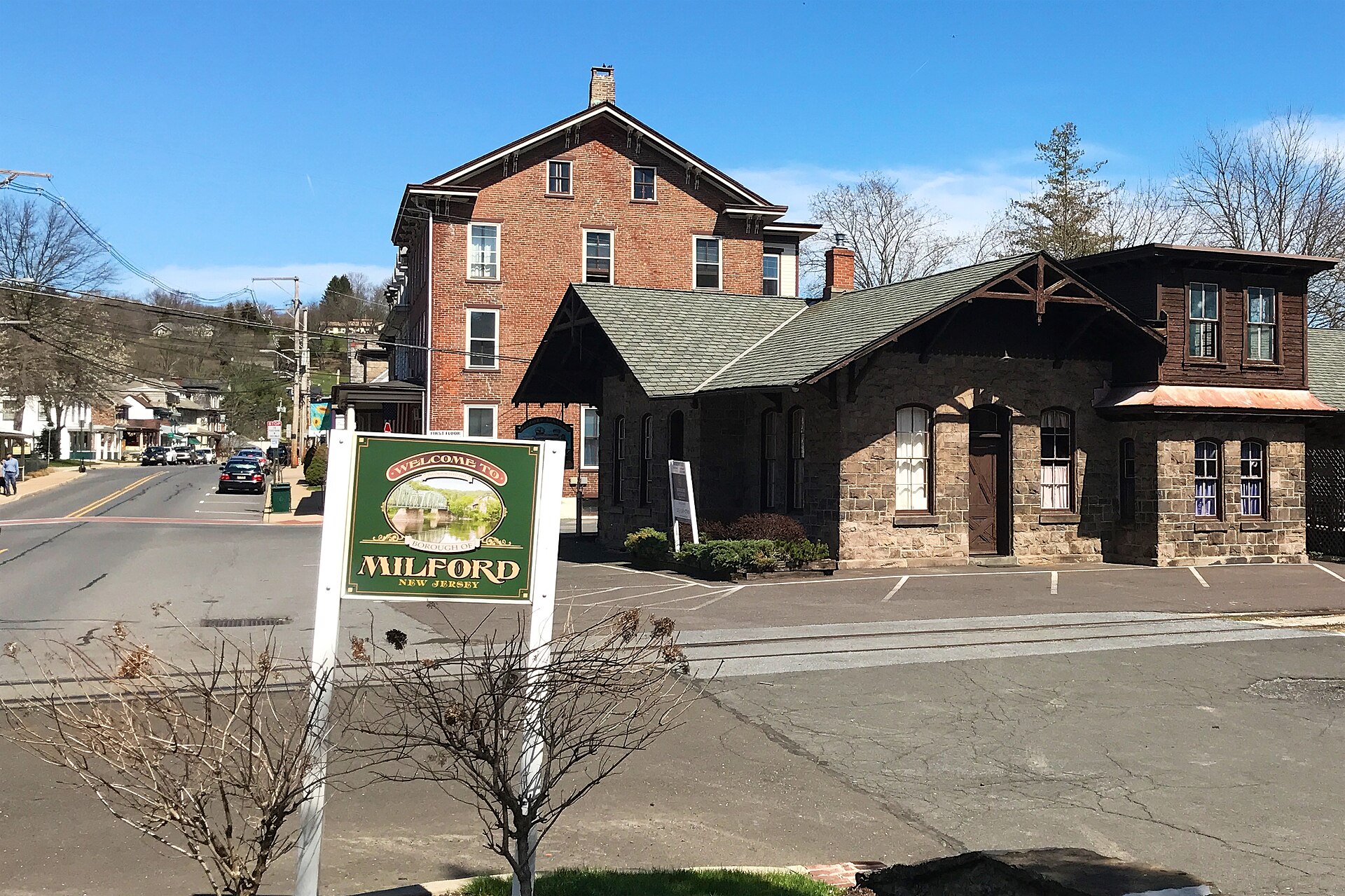 View of Bridge Street, by Railroad Avenue, in Milford, New Jersey. Shows former station of the Belvidere Delaware Railroad in the foreground. Contributing property #2 of the Milford Historic District.
