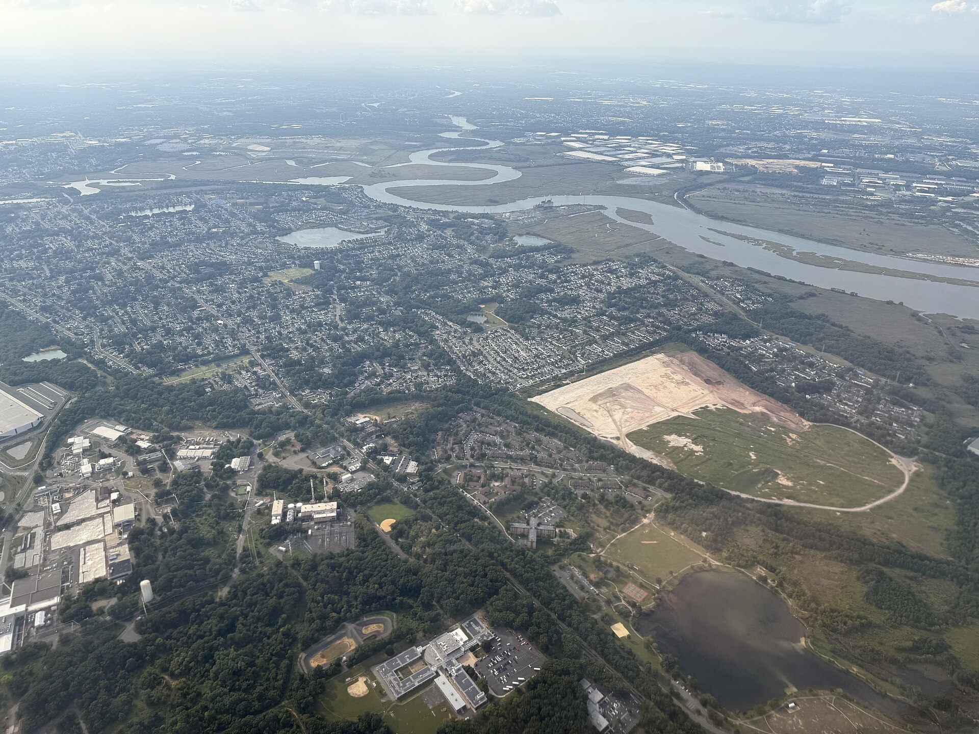 Aerial view of western Sayreville, Middlesex County, New Jersey and surrounding areas including the Raritan River from an aircraft heading for Newark Liberty International Airport