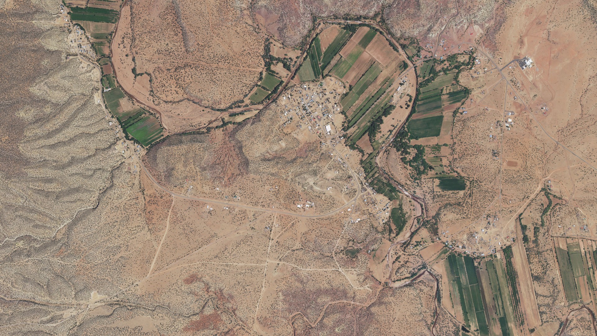 Natural-color aerial photograph of land around Anton Chico, New Mexico