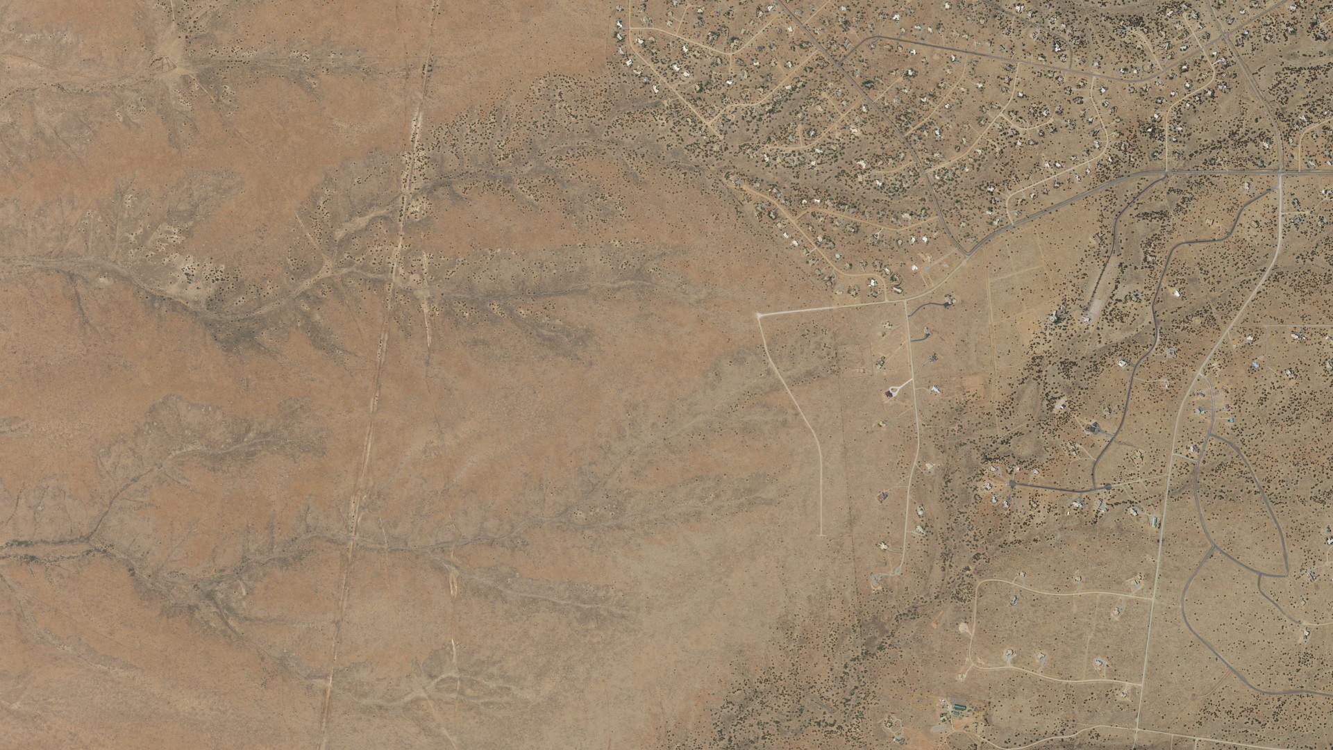 Natural-color aerial photograph of land around Santa Fe County, New Mexico