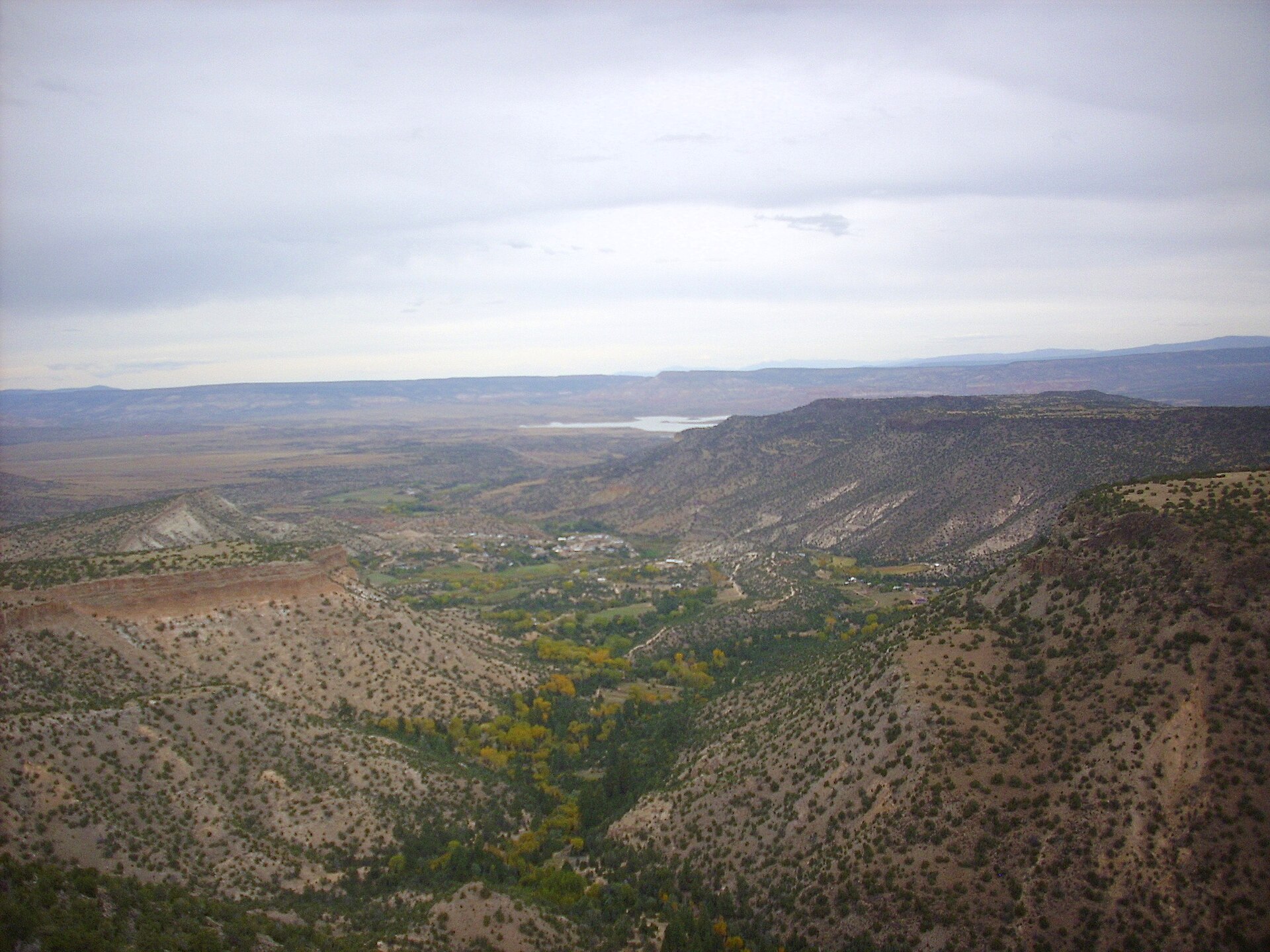 This image shows the community of Canones, New Mexico, in late 2016. The view is from the edge of Polvadera Mesa south of the community. — Cañones, New Mexico