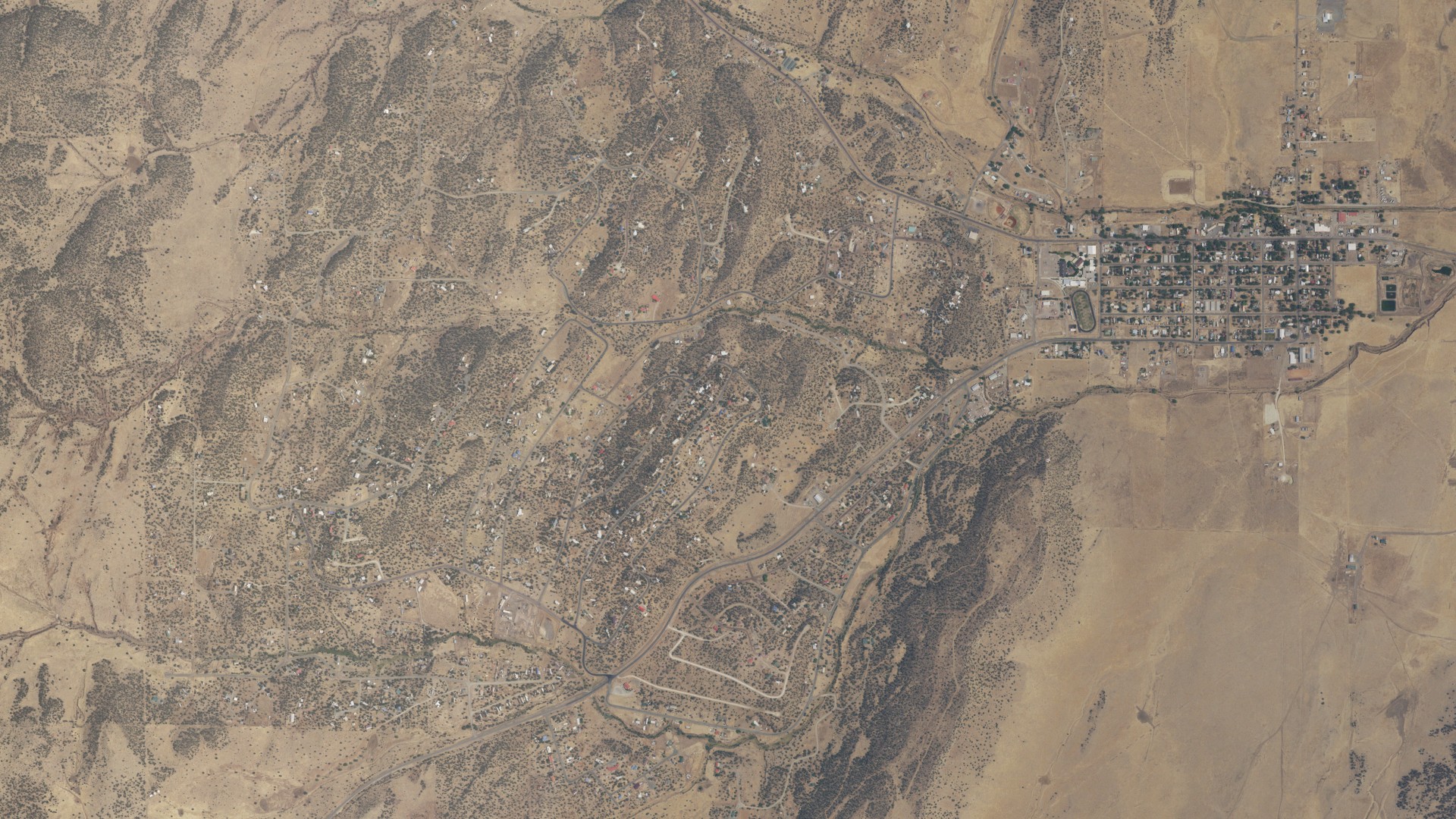 Natural-color aerial photograph of land around Capitan, New Mexico