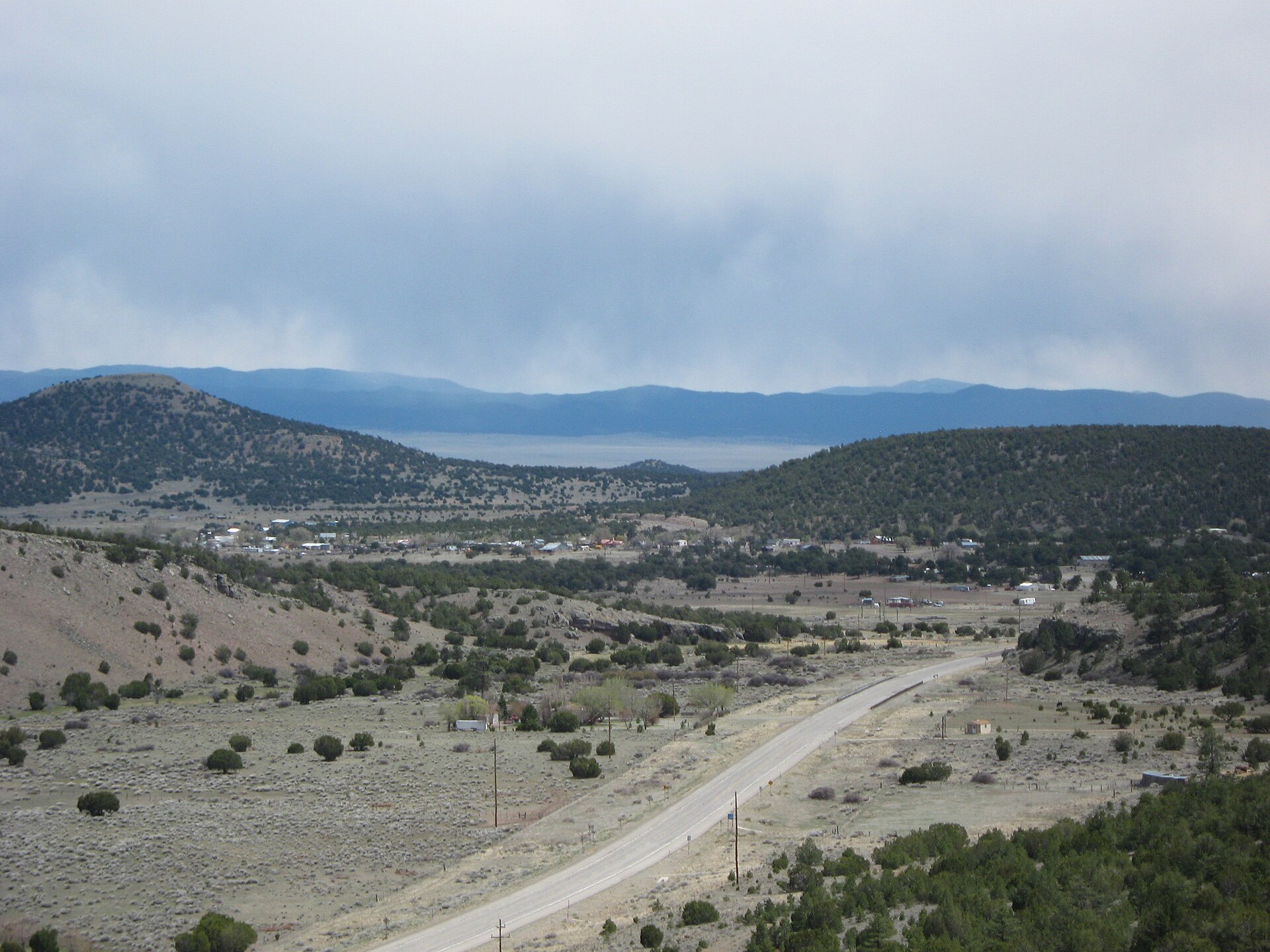 Datil, New Mexico, viewed from approximately two miles northwest. U.S. Highway 60 passes through the picture. The Plains of San Agustin are visible in the distance.