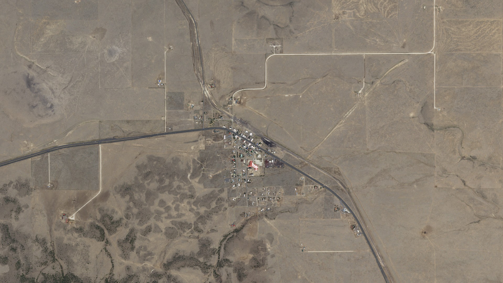 Natural-color aerial photograph of land around Des Moines, New Mexico
