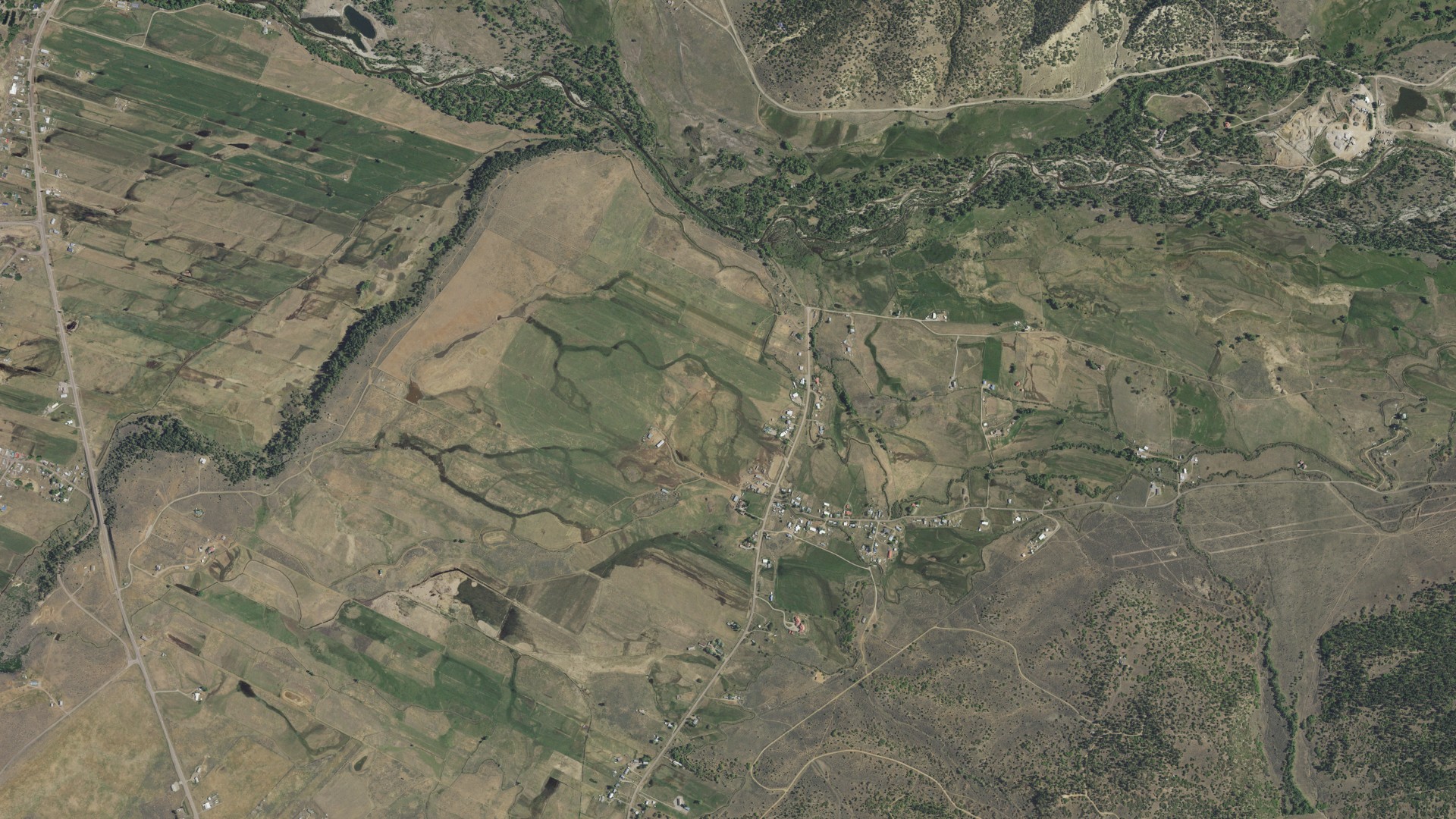 Natural-color aerial photograph of land around Ensenada, New Mexico