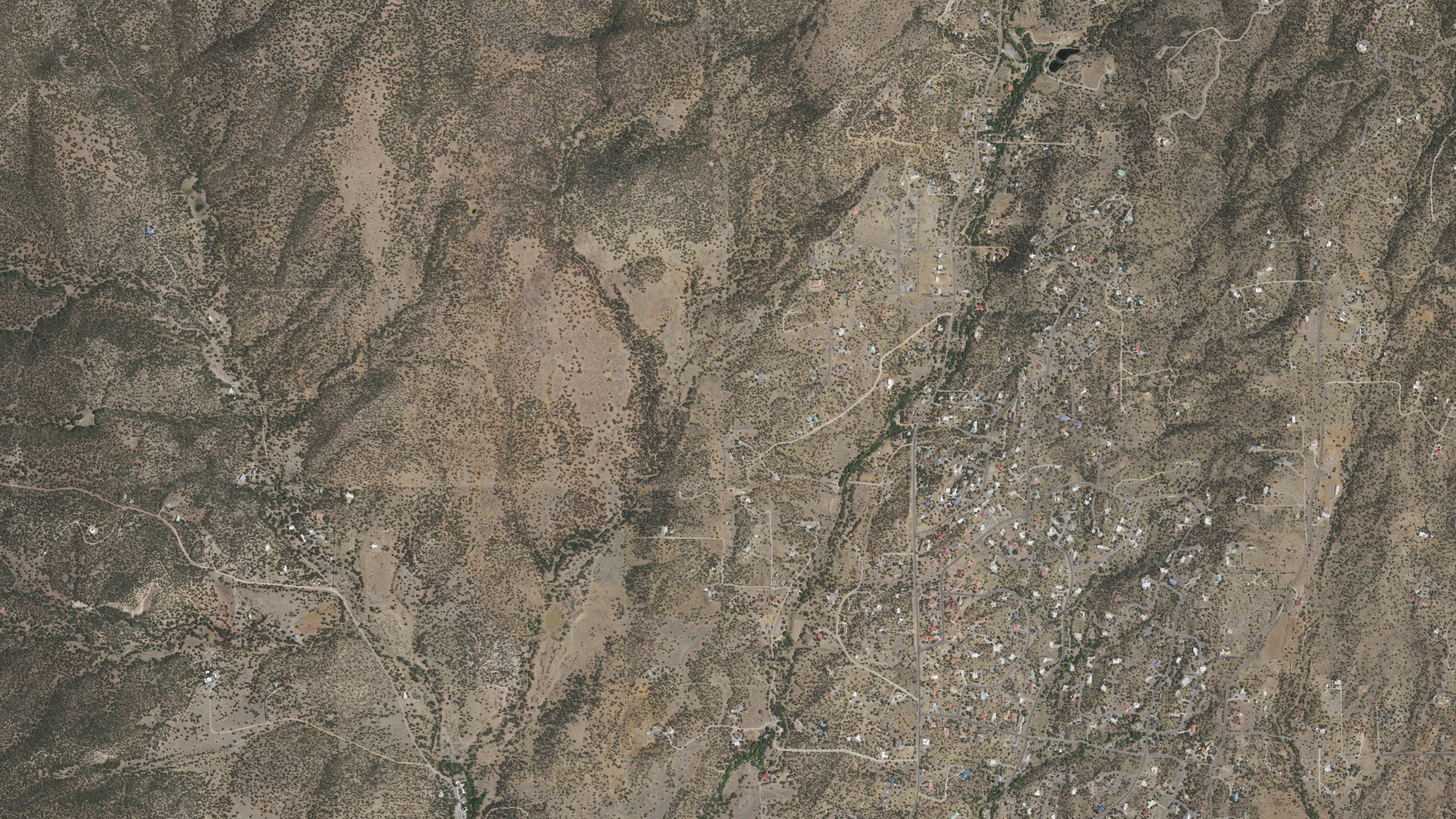 Natural-color aerial photograph of land around Little Walnut Village, New Mexico