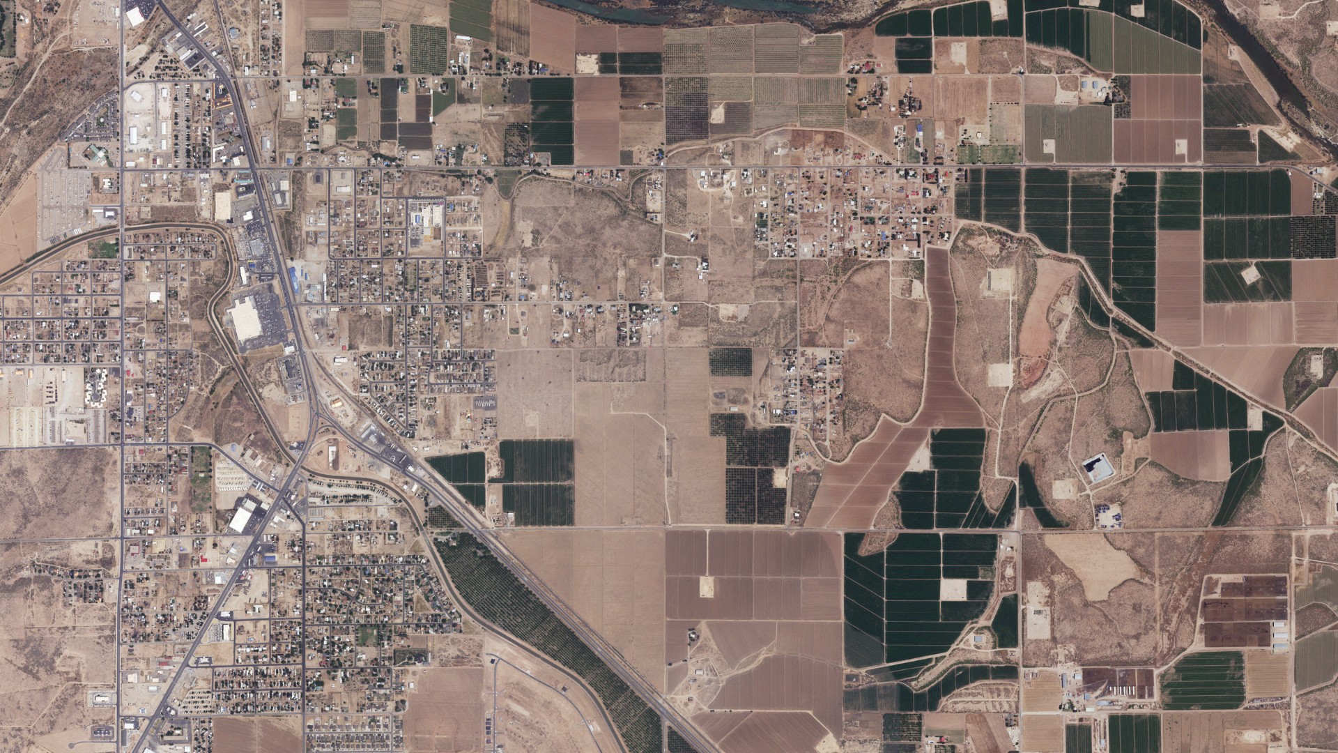 Natural-color aerial photograph of land around Livingston Wheeler, New Mexico