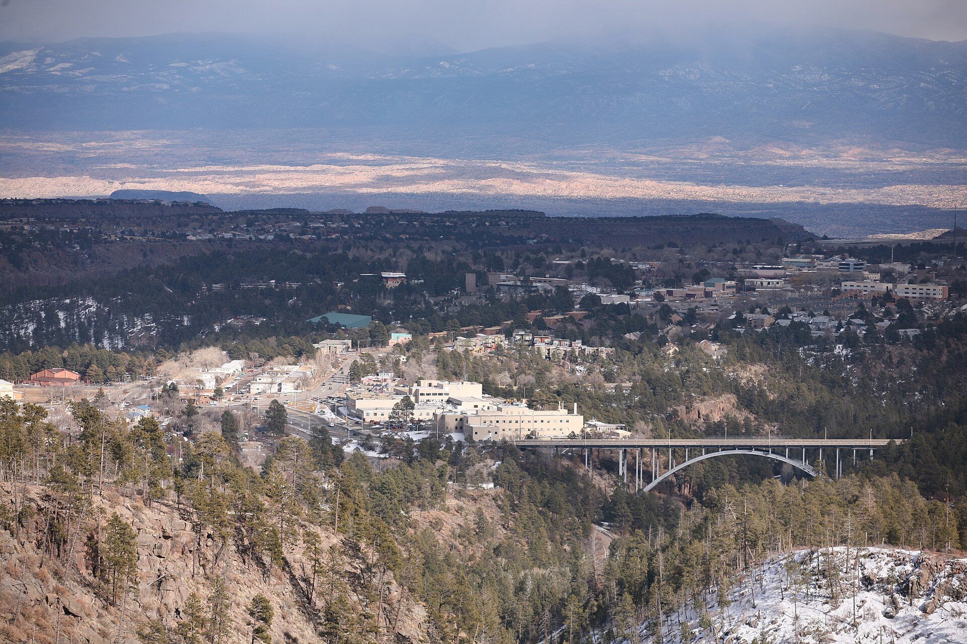 View over Los Alamos, New Mexico. The bridge in the lower right is Omega bridge across Los Alamos Canyon.