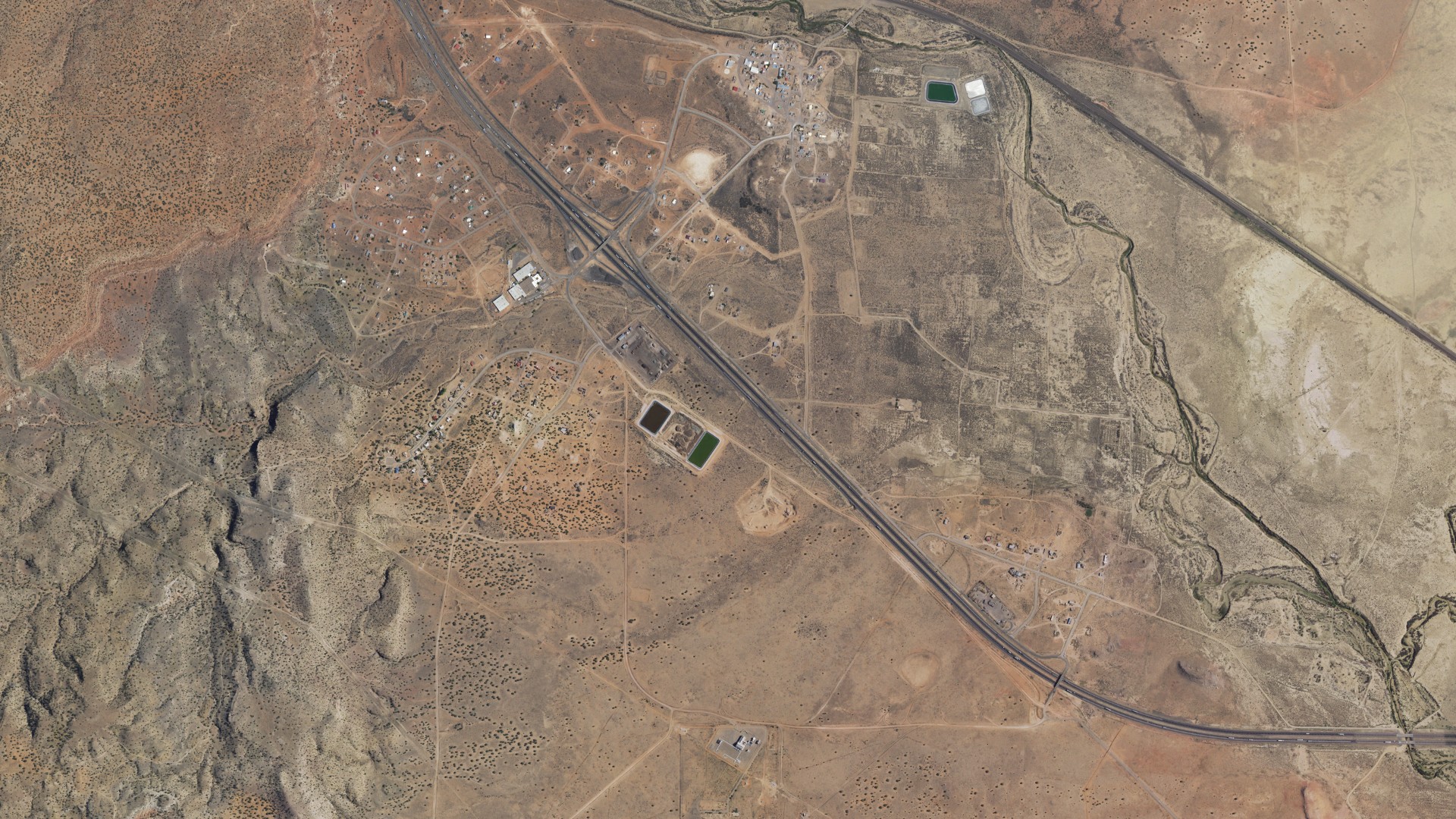 Natural-color aerial photograph of land around Mesita, New Mexico