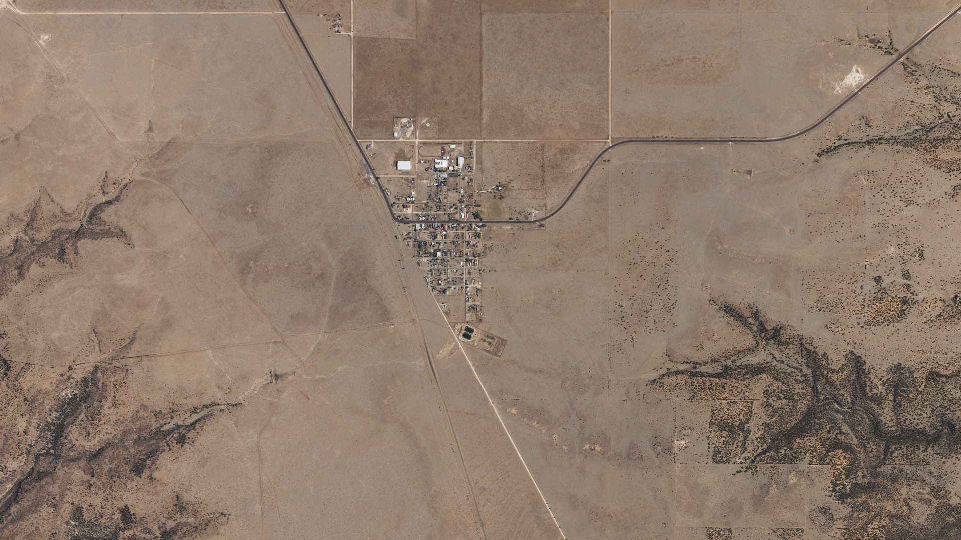 Natural-color aerial photograph of land around Mosquero, New Mexico