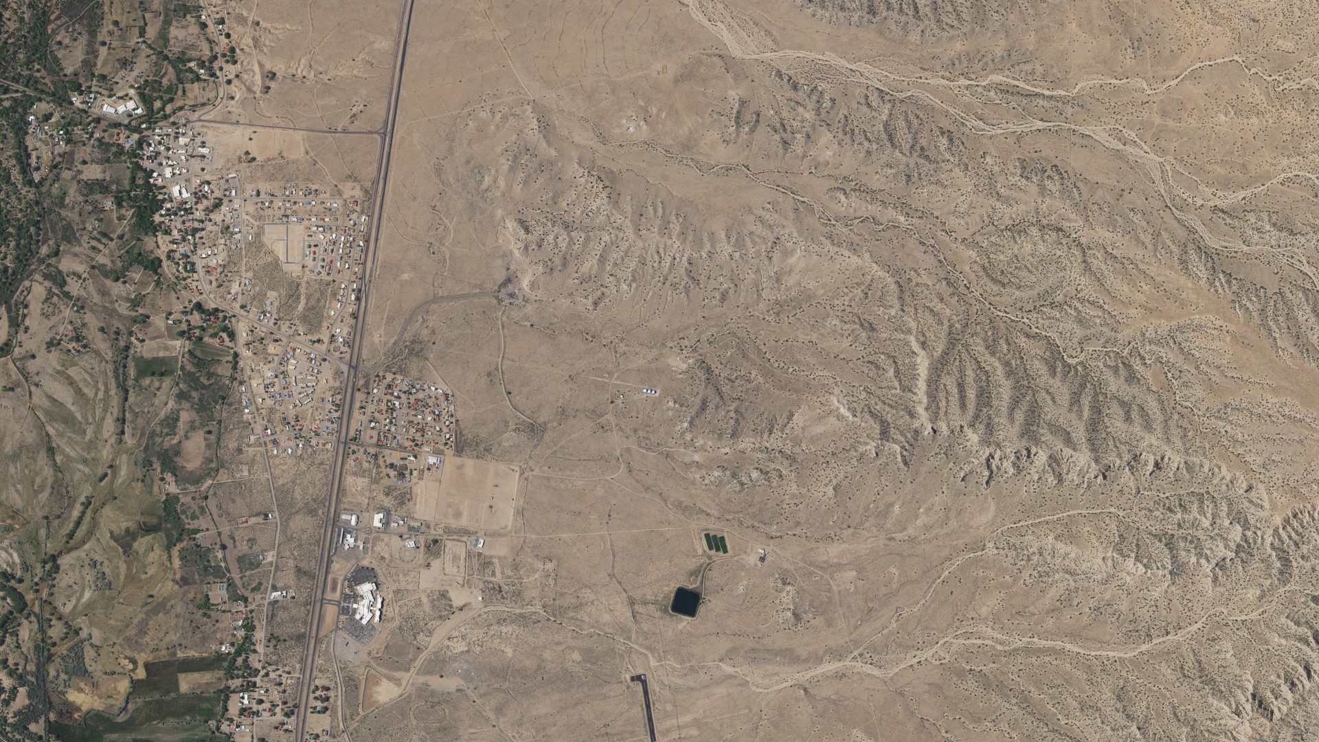 Natural-color aerial photograph of land around Ohkay Owingeh, New Mexico