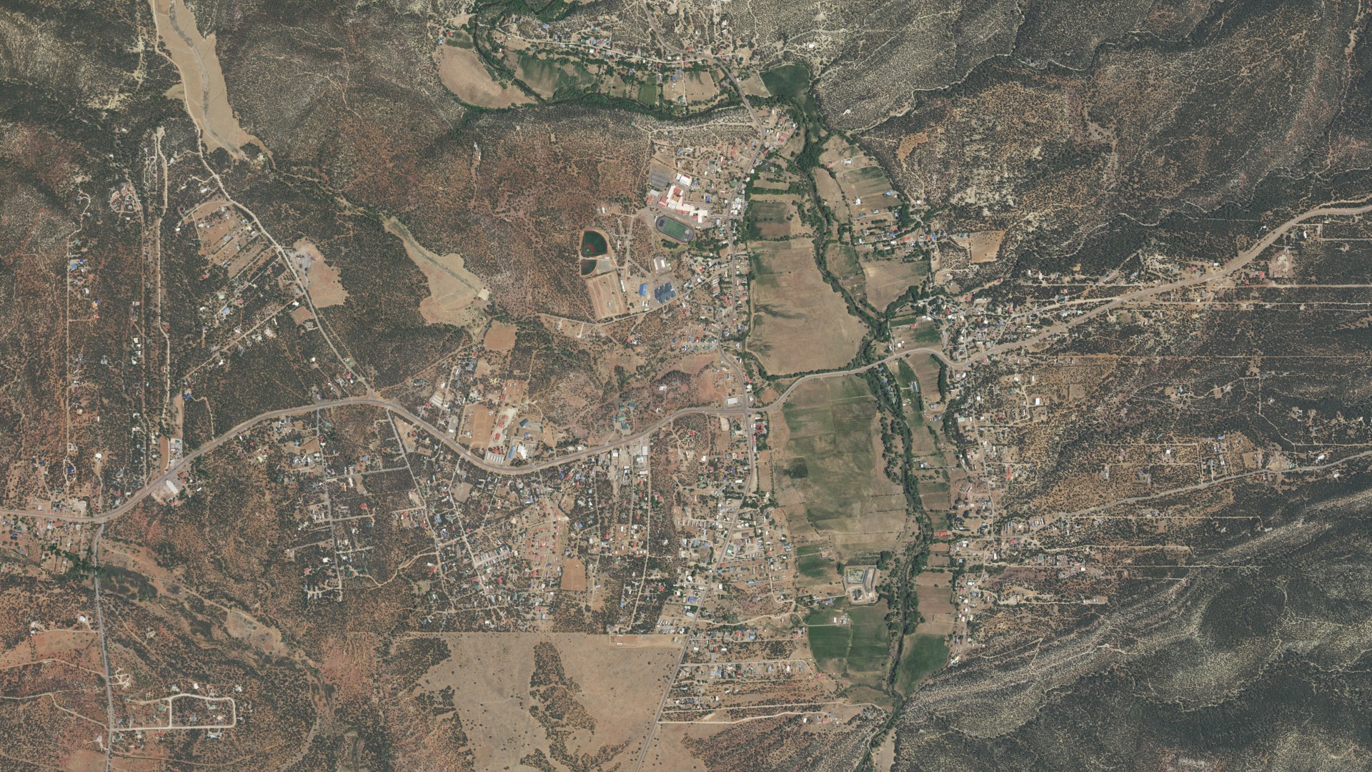 Natural-color aerial photograph of land around Pecos, New Mexico