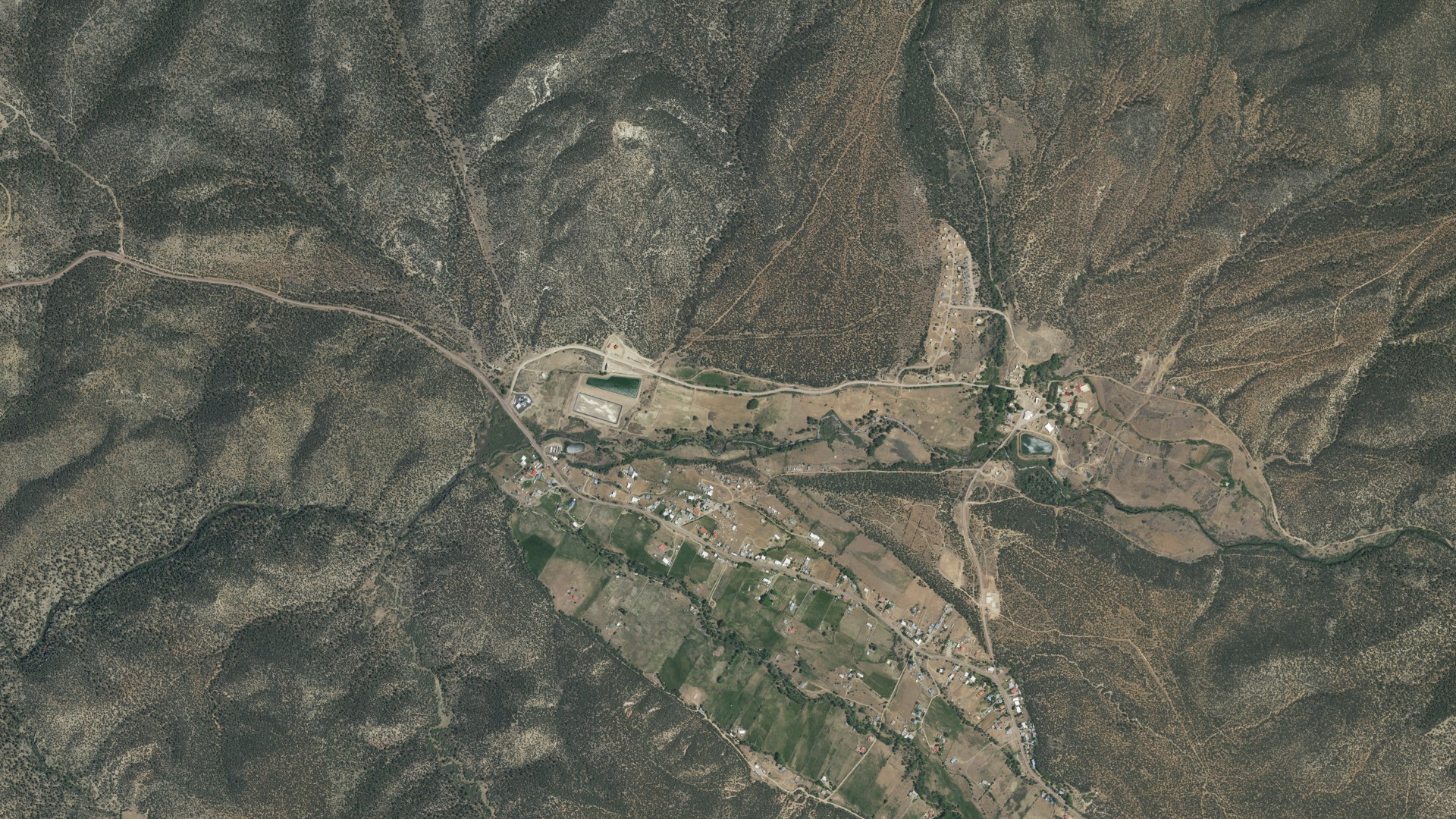 Natural-color aerial photograph of land around Picuris Pueblo, New Mexico