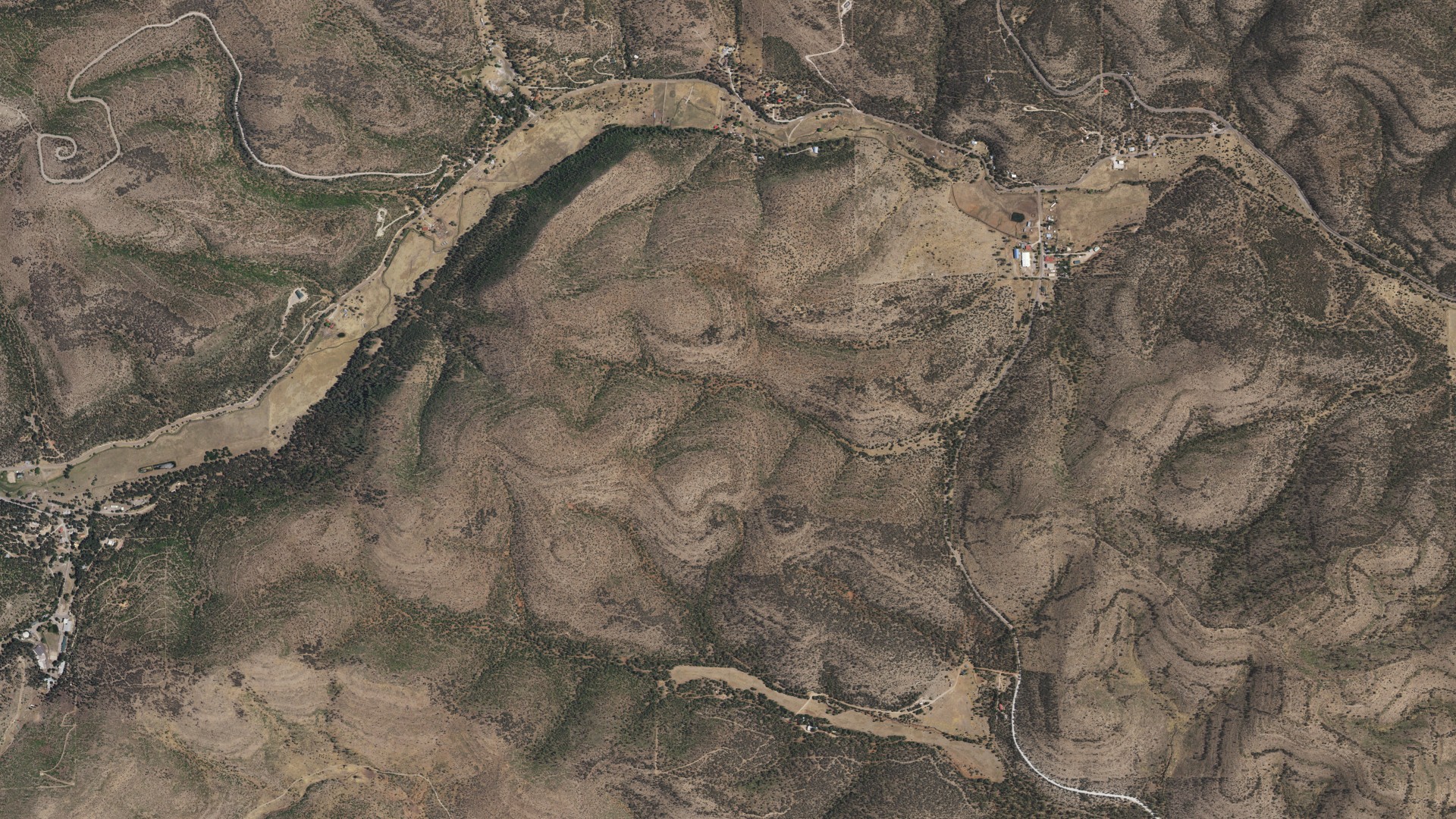 Natural-color aerial photograph of land around Weed, New Mexico