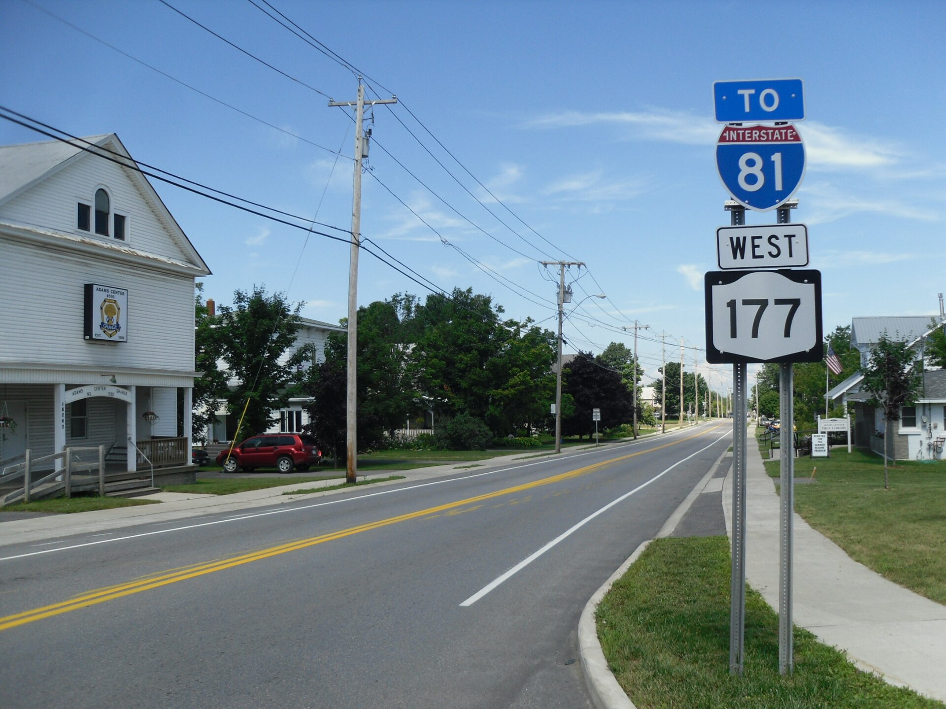 New York State Route 177 westbound heading through the hamlet of Adams Center towards Interstate 81.