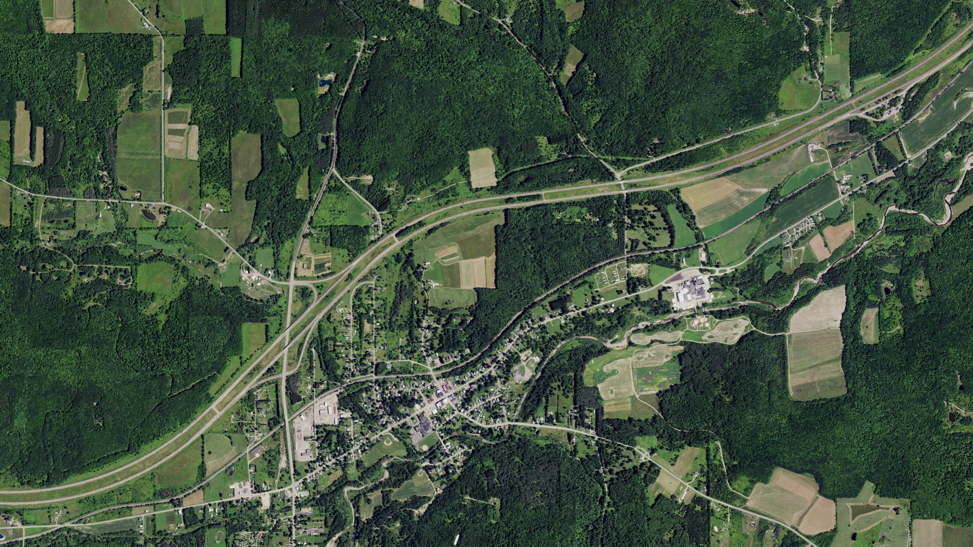 Natural-color aerial photograph of land around Friendship, New York