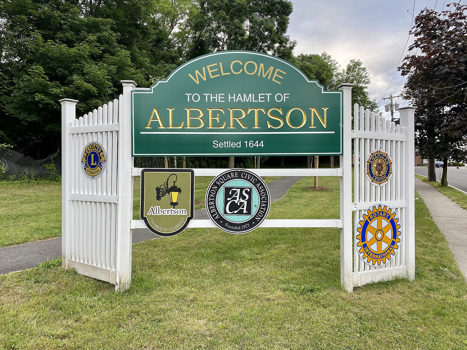 A Welcome Sign to Albertson on Willis Avenue in Albertson, Long Island, New York. This photo was taken on June 12, 2021.