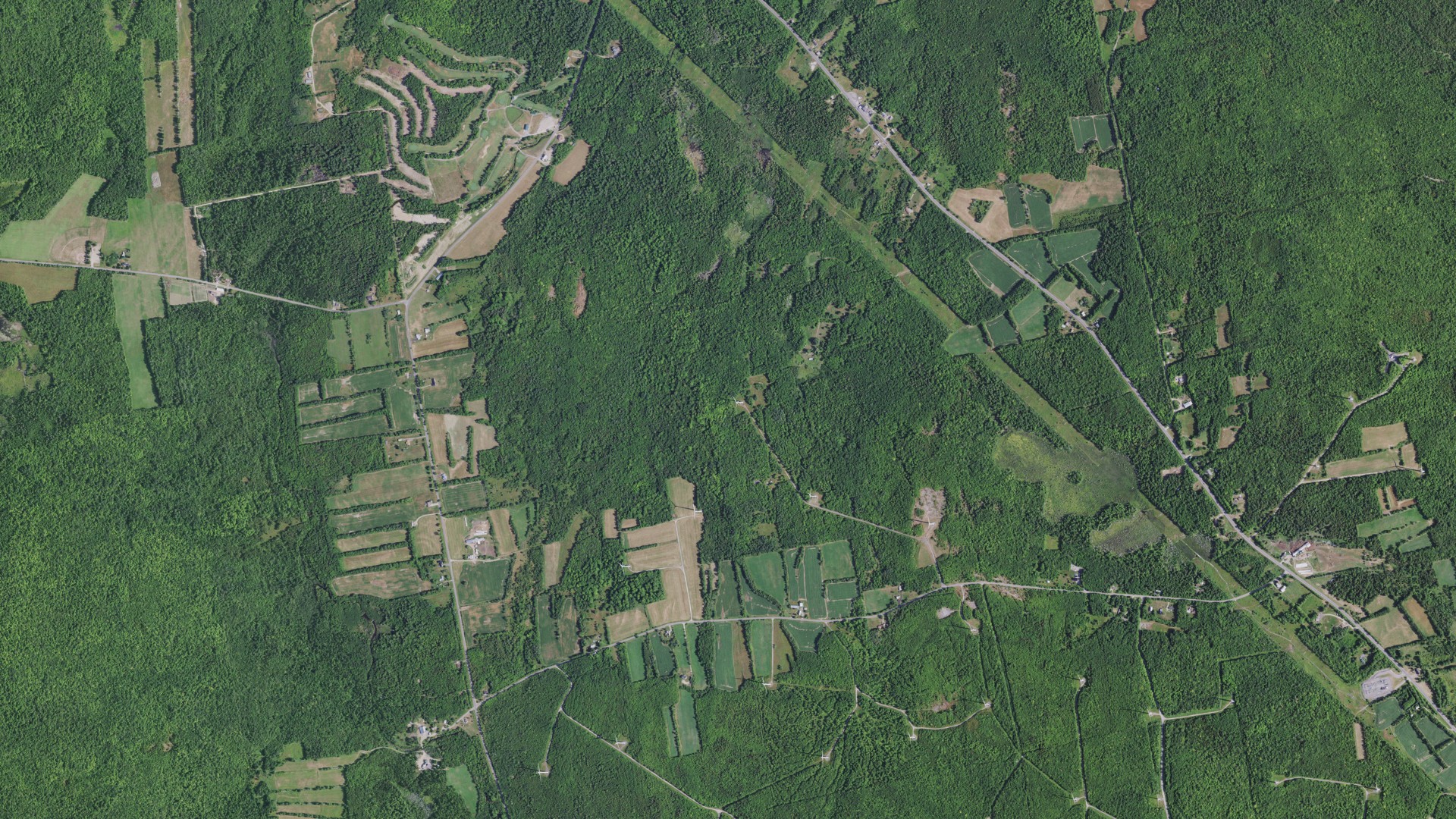 Natural-color aerial photograph of land around Altona, New York
