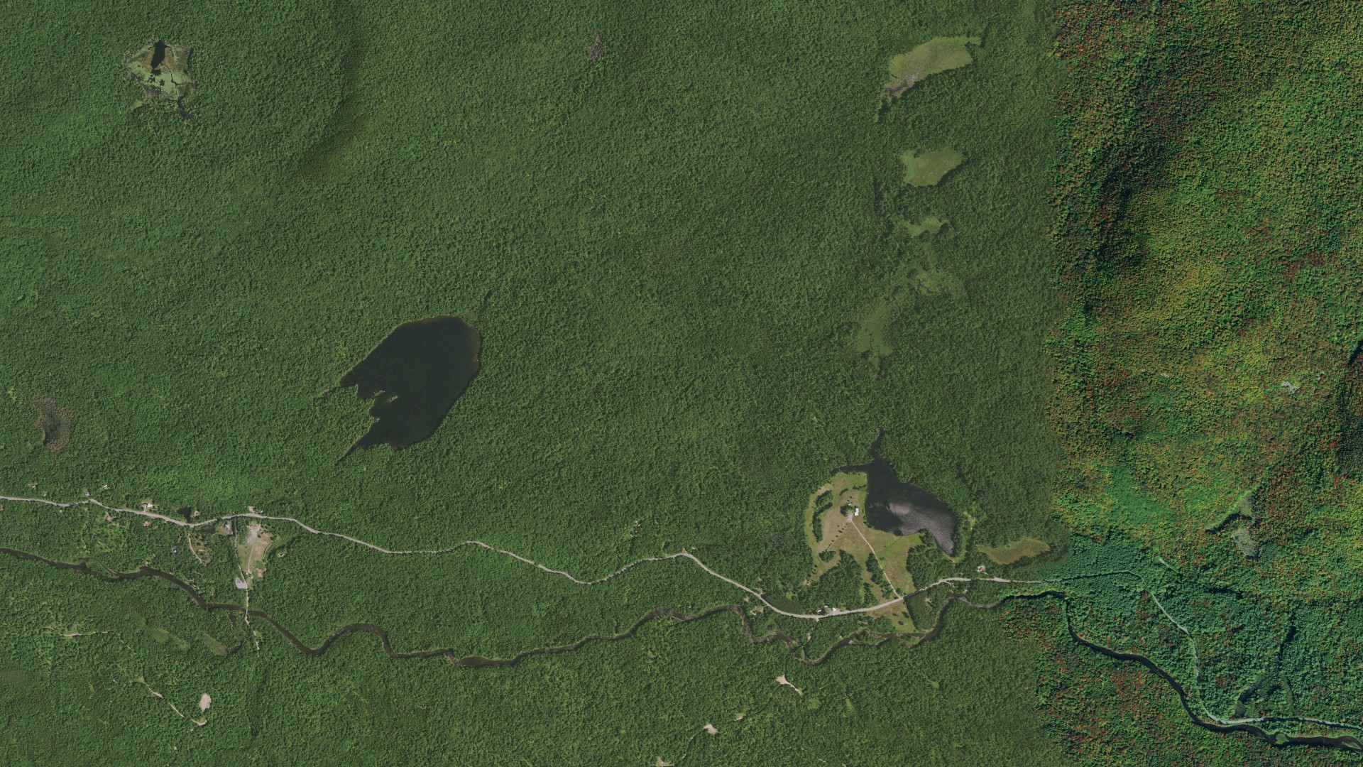 Natural-color aerial photograph of land around Indian Lake, New York