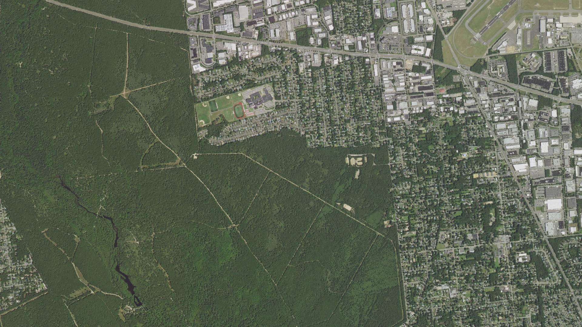 Natural-color aerial photograph of land around Bohemia, New York