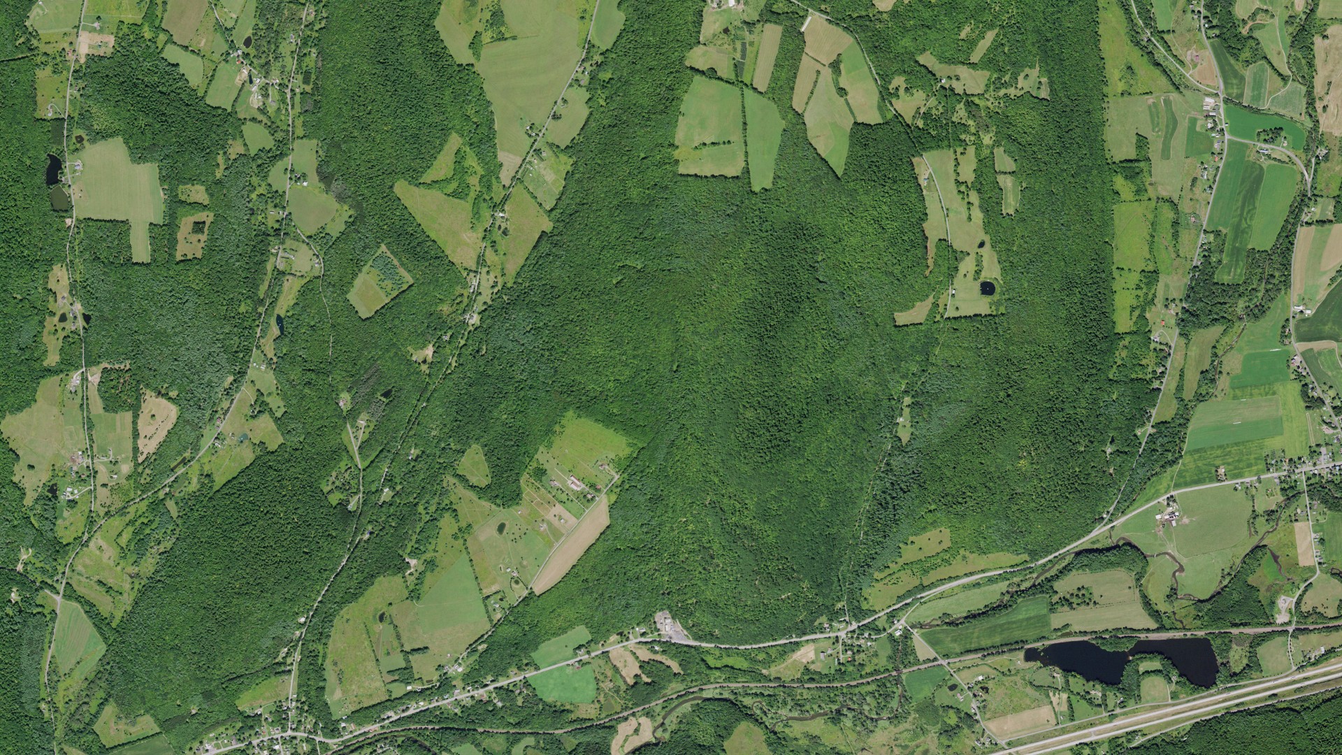 Natural-color aerial photograph of land around Maryland, New York