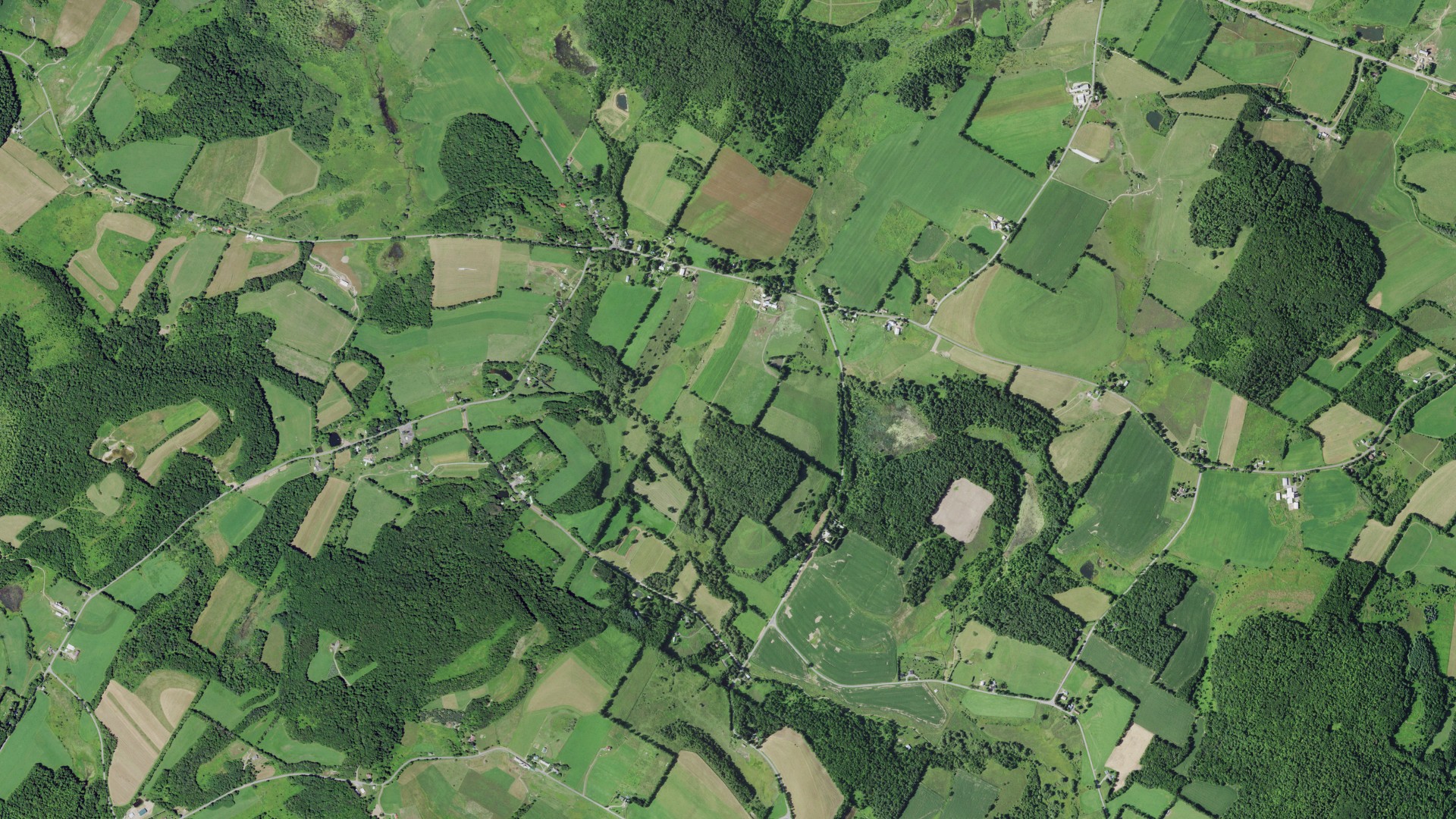 Natural-color aerial photograph of land around Richfield, New York