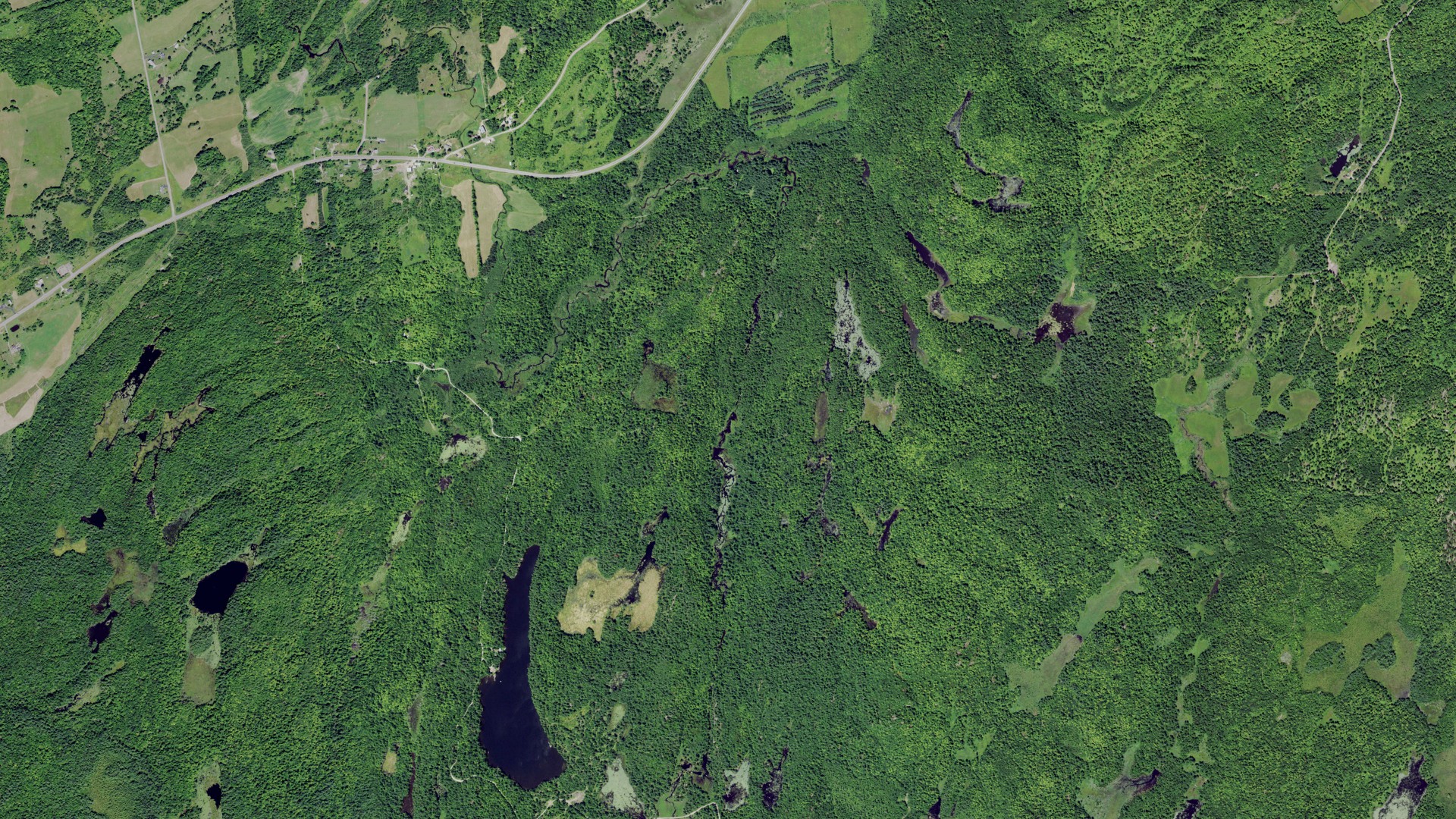 Natural-color aerial photograph of land around Edwards, New York