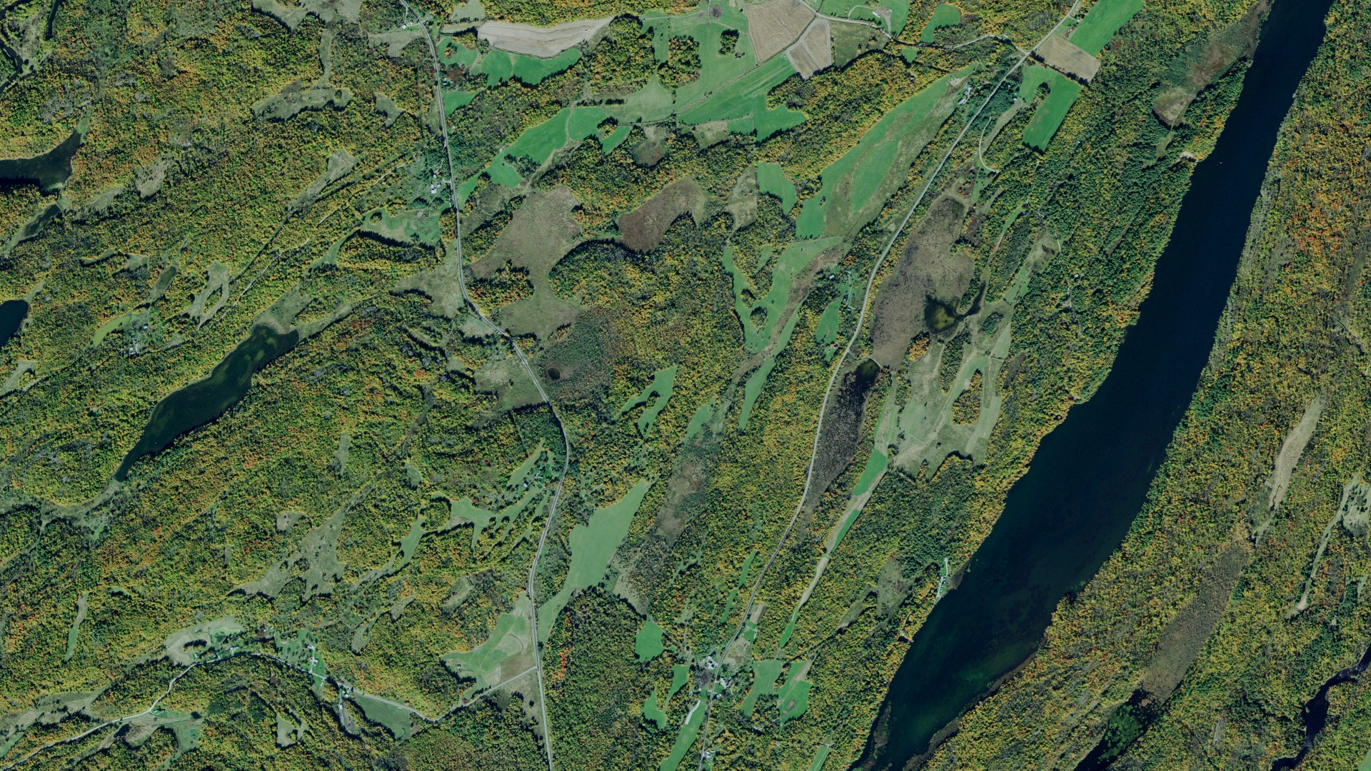 Natural-color aerial photograph of land around Rossie, New York