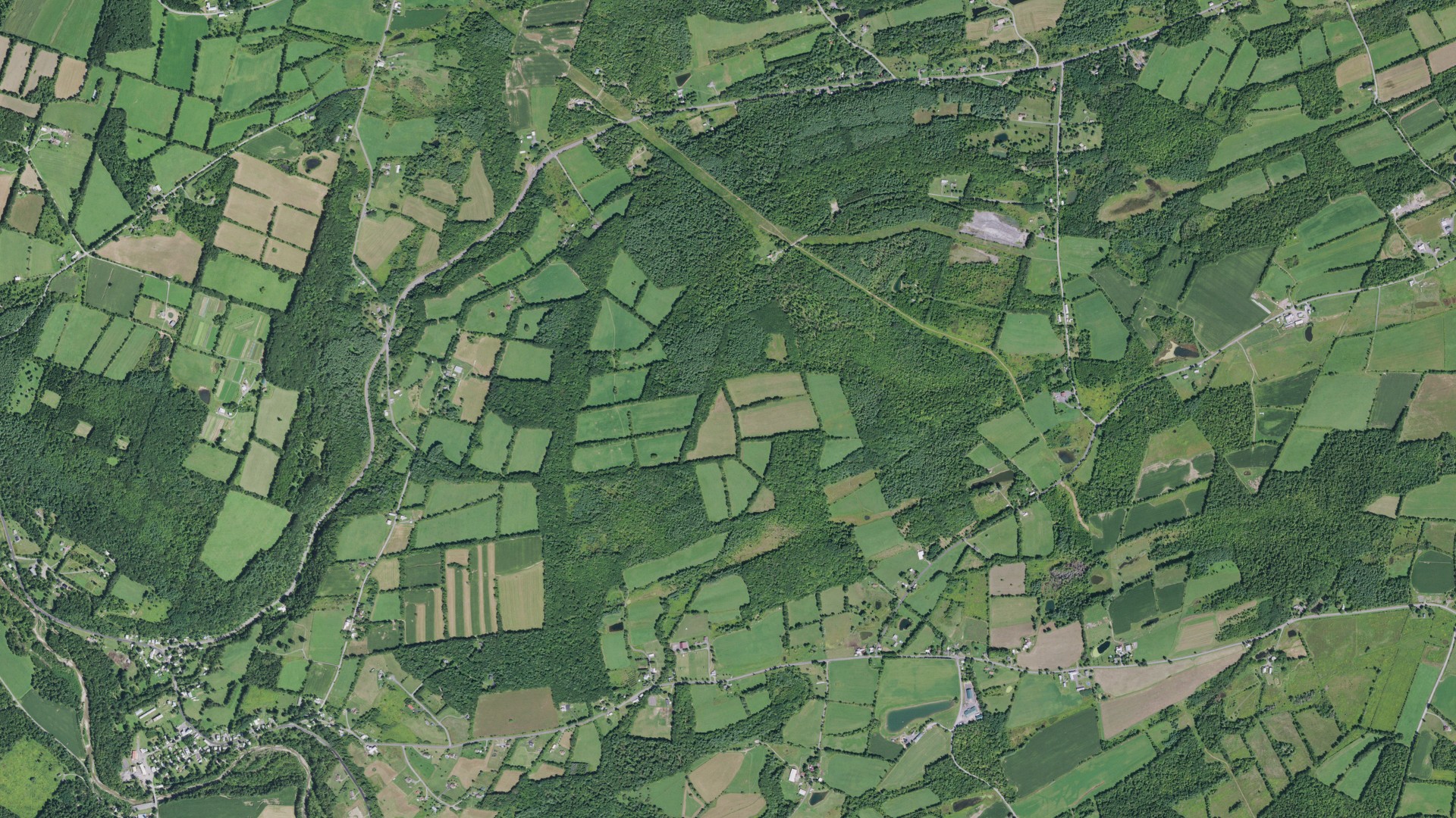 Natural-color aerial photograph of land around Wright, New York