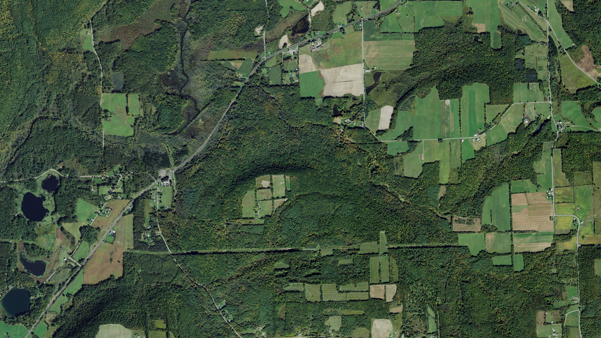 Natural-color aerial photograph of land around Bradford, New York
