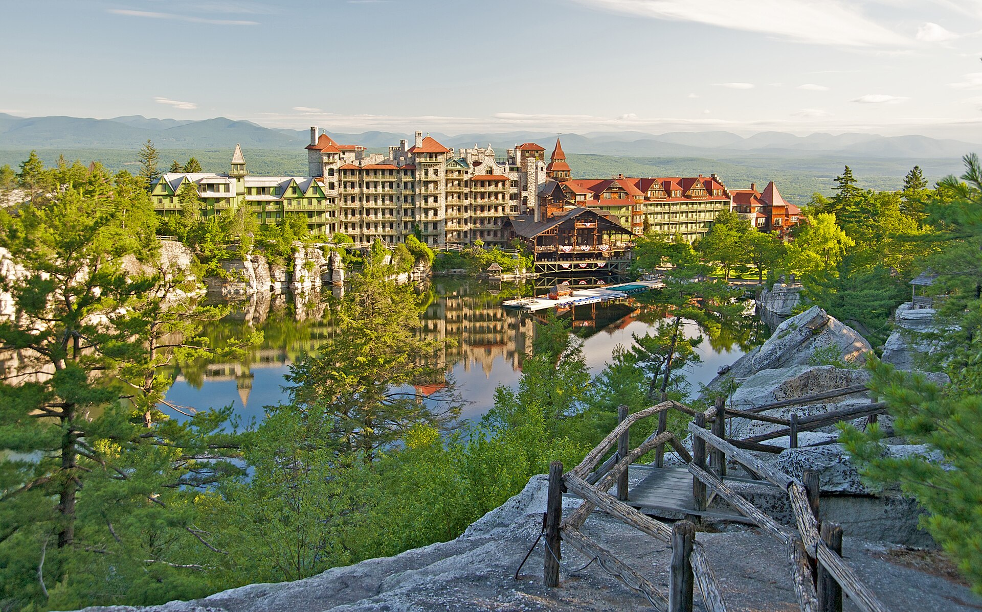 View of guest rooms that surround Lake Mohonk seen from one of many hiking trails at Mohonk Mountain House — Ulster County, New York
