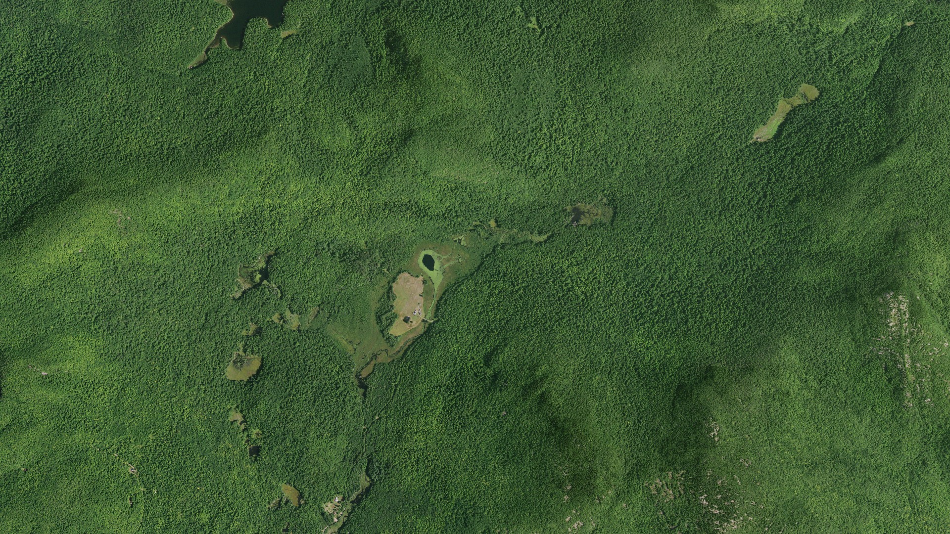 Natural-color aerial photograph of land around Thurman, New York
