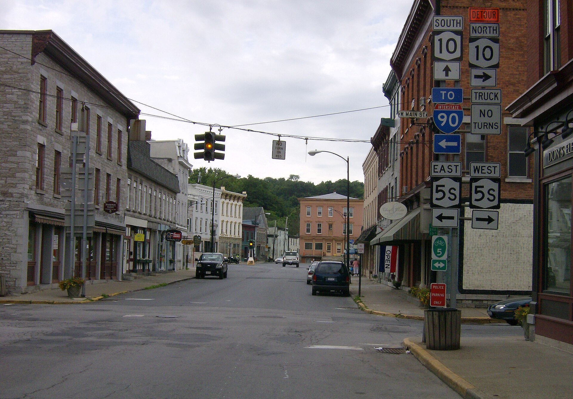 Route 10 as Church Street southbound, at intersection with Route 5S as Main Street, with Dummy Light in the background. Note the two traffic signals are synchronized. — Canajoharie, New York
