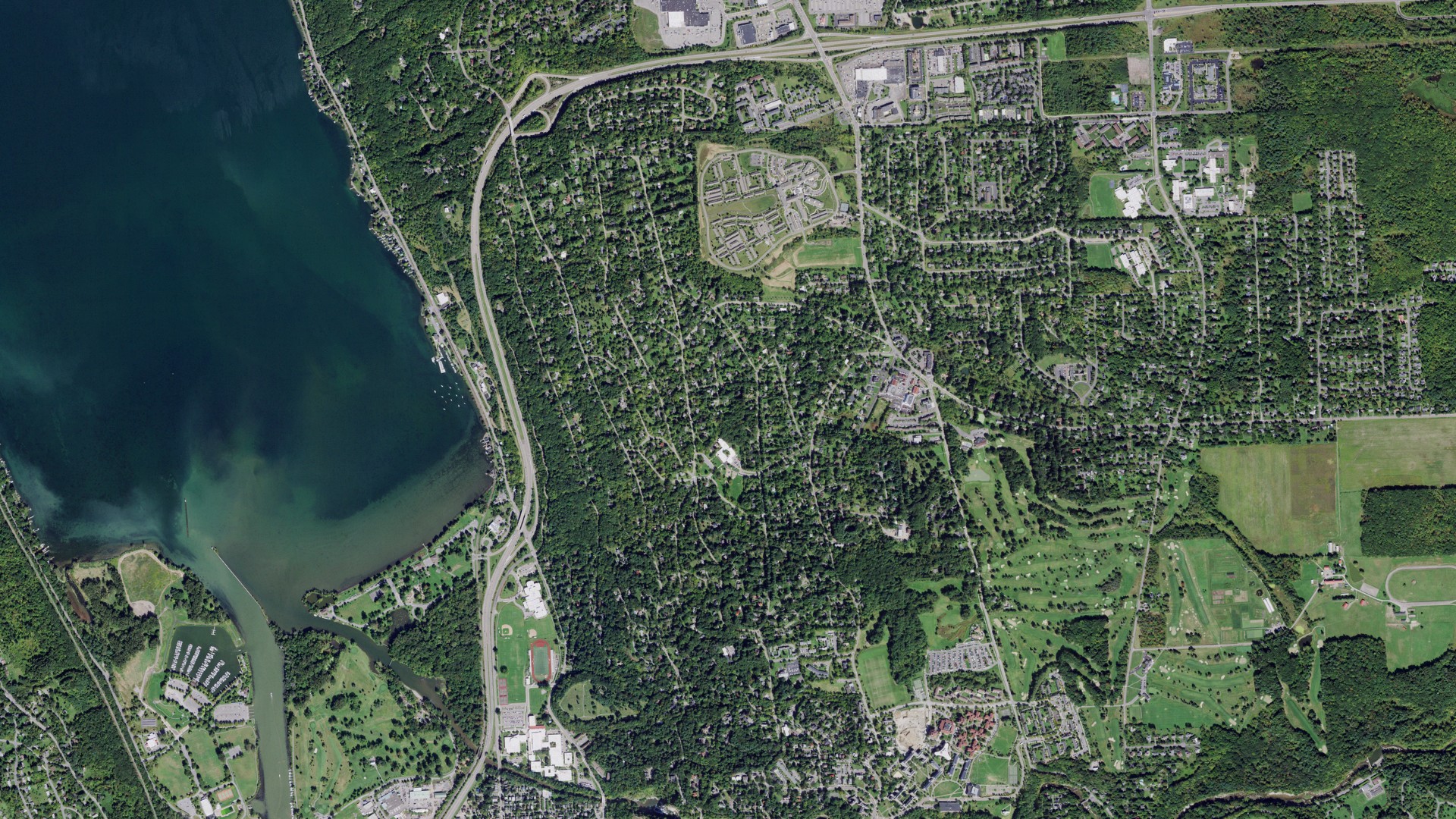 Natural-color aerial photograph of land around Cayuga Heights, New York
