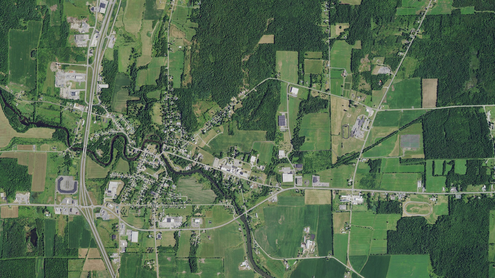Natural-color aerial photograph of land around Champlain, New York