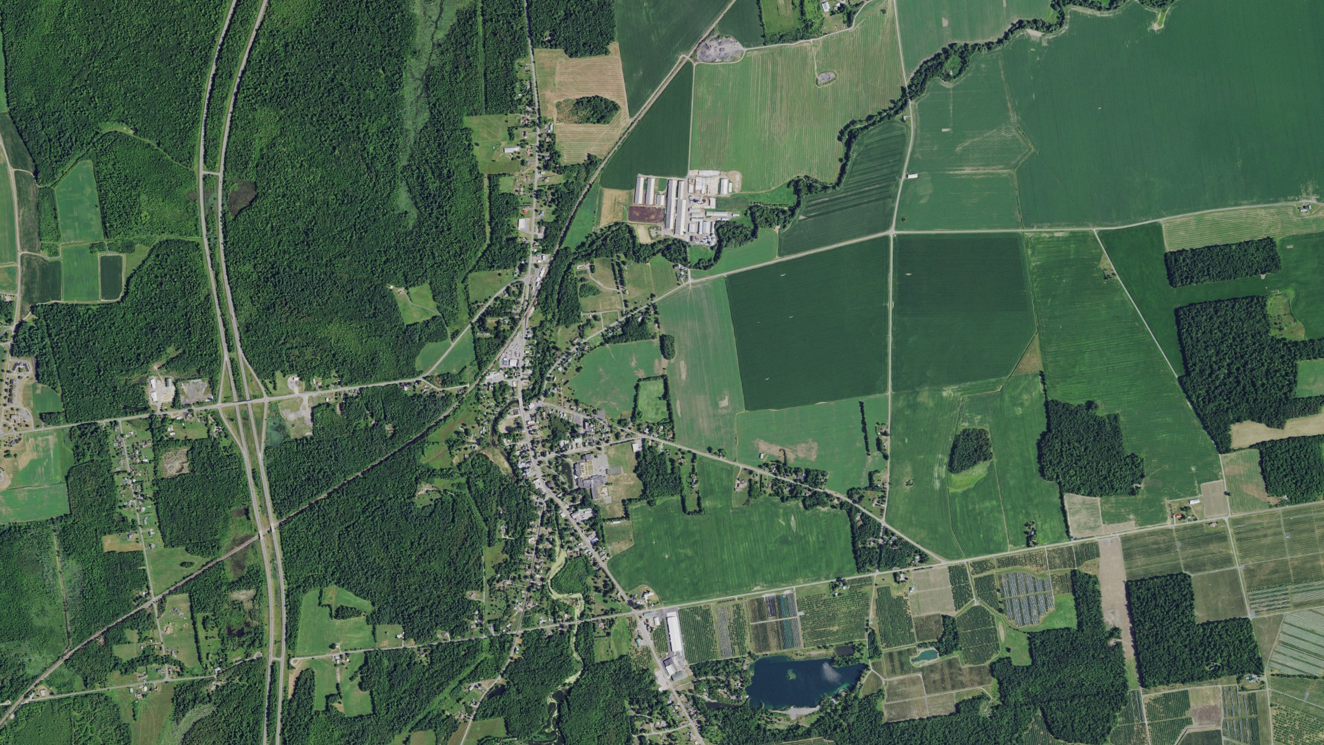 Natural-color aerial photograph of land around Chazy, New York