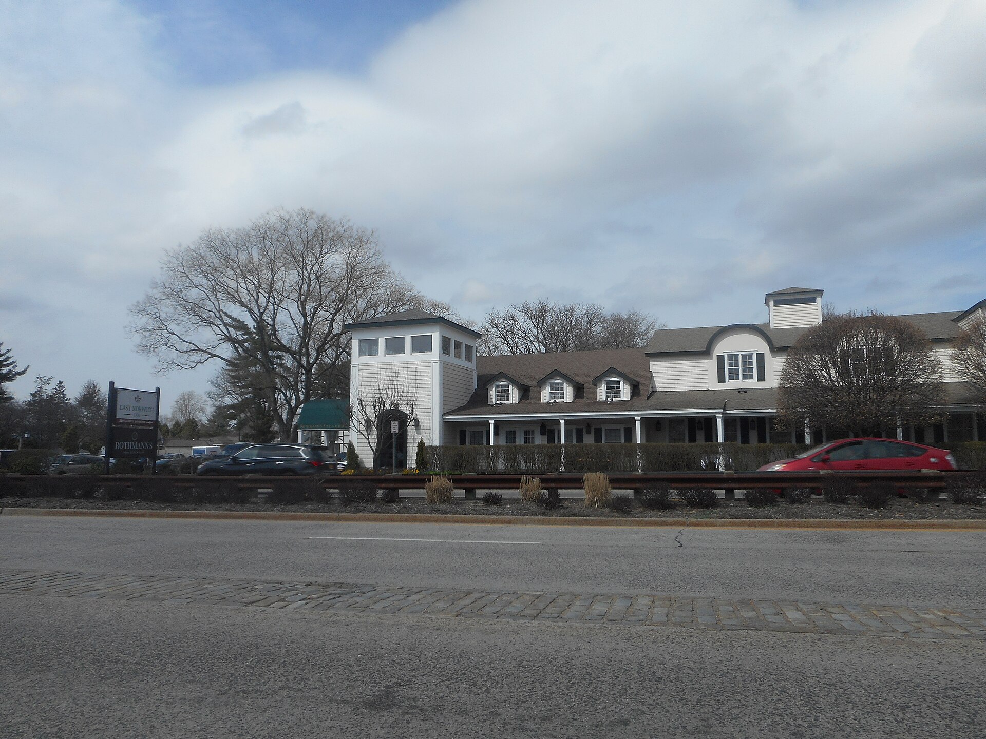 Roadside shot of the long-standing East Norwich Inn along the north side of New York State Route 25A near New York State Route 106 in East Norwich, New York.