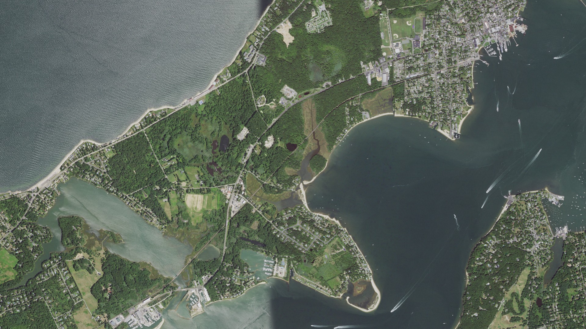 Natural-color aerial photograph of land around Greenport West, New York