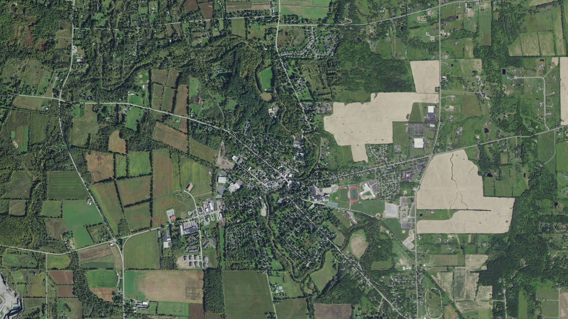 Natural-color aerial photograph of land around Honeoye Falls, New York