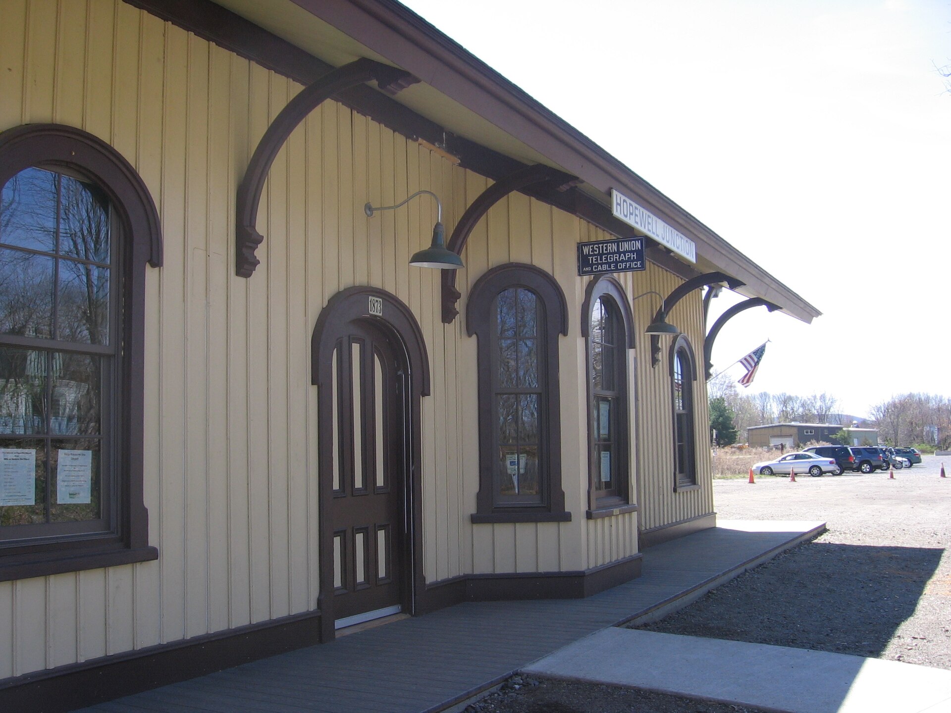 Hopewell Junction Depot along the Dutchess County Rail Trail. The former location of the depot was just beyond the cars in the parking lot. — New York