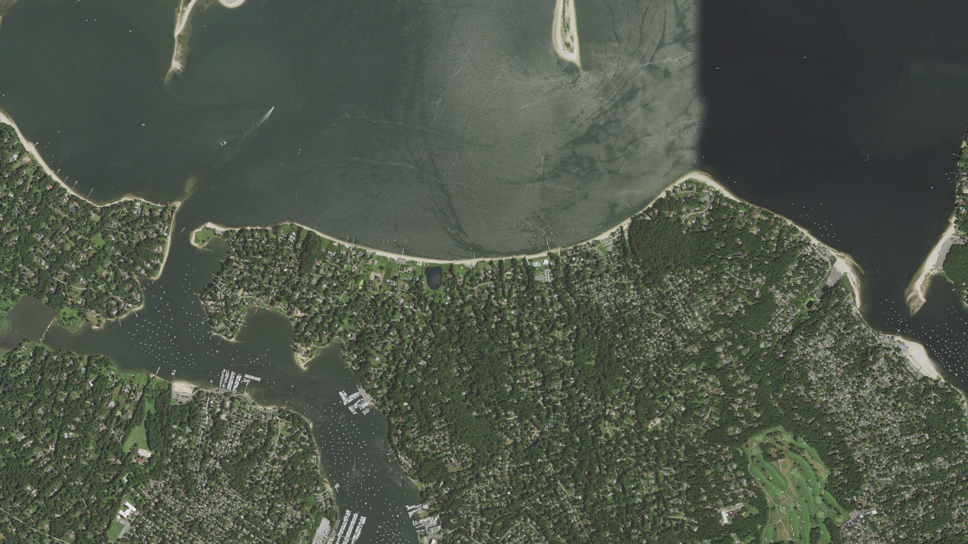 Natural-color aerial photograph of land around Huntington Bay, New York